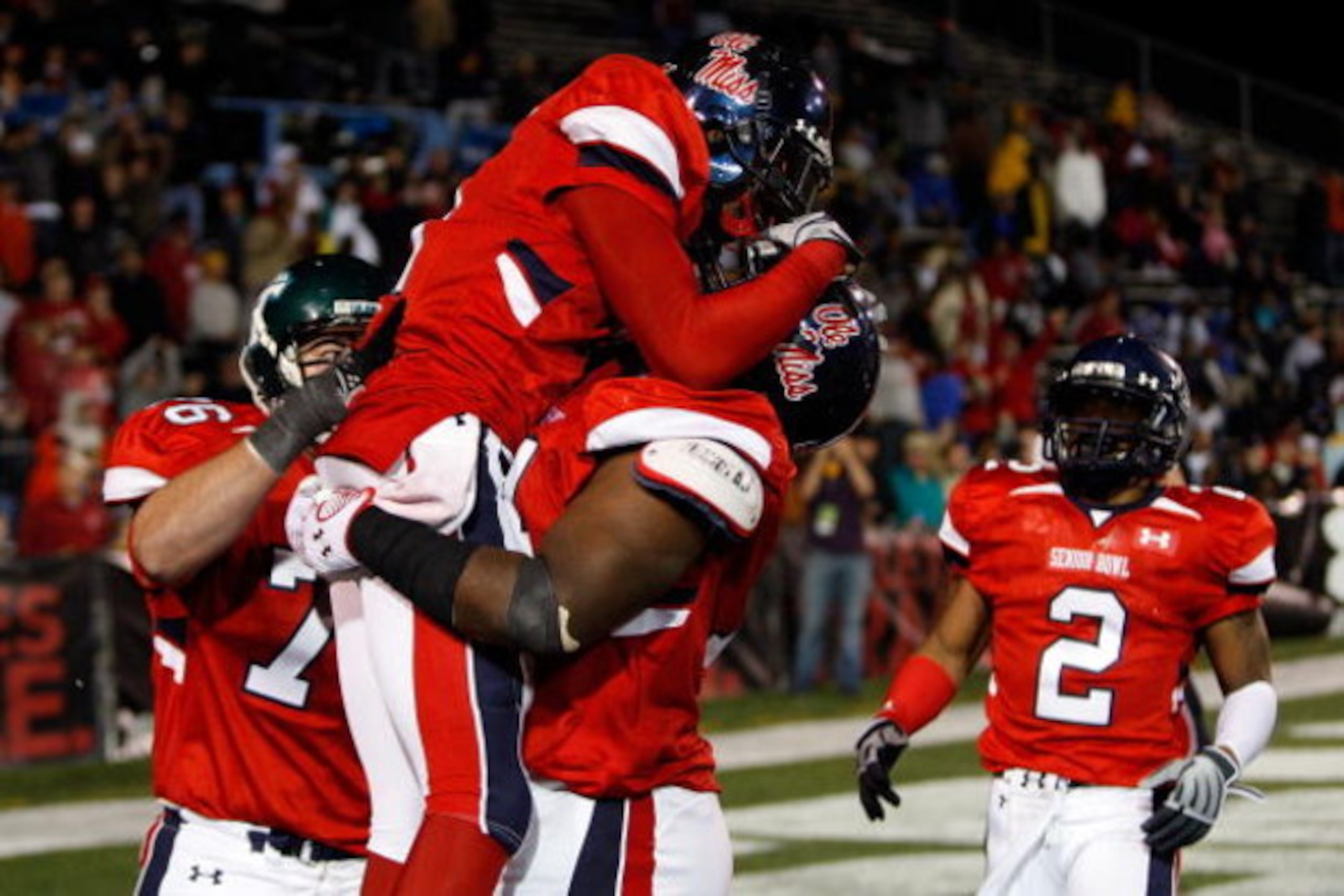MOBILE, AL - JANUARY 24: Mike Wallace #9 and Michael Oher #74 of the South Team celebrate after Wallace scored a touchdown against the North Team during the Under Armour Senior Bowl on January 24, 2009 at Ladd-Peebles Stadium in Mobile, Alabama. (Photo by MOBILE, AL - JANUARY 24: Mike Wallace #9 and Michael Oher #74 of the South Team celebrate after Wallace scored a touchdown against the North Team during the Under Armour Senior Bowl on January 24, 2009 at Ladd-Peebles Stadium in Mobile, Alabama. (Photo by