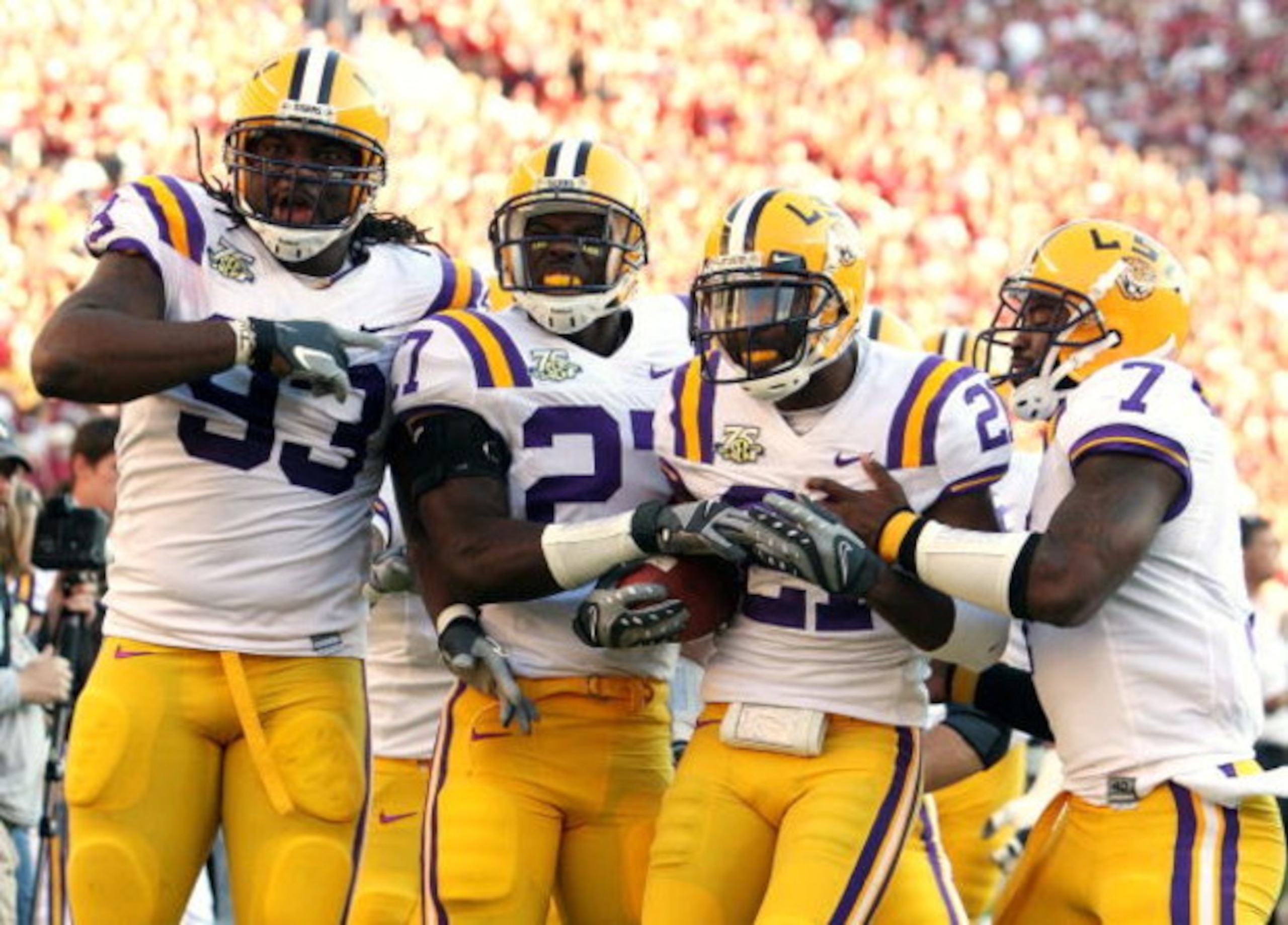 TUSCALOOSA, AL - NOVEMBER 03: Defenders Tyson Jackson #93, Curtis Taylor #27, Chevis Jackson #21 and Ali Highsmith #7 of the LSU Tigers celebrate Chevis Jackson's first half interception against the Alabama Crimson Tide at Bryant-Denny Stadium on Novembe TUSCALOOSA, AL - NOVEMBER 03: Defenders Tyson Jackson #93, Curtis Taylor #27, Chevis Jackson #21 and Ali Highsmith #7 of the LSU Tigers celebrate Chevis Jackson's first half interception against the Alabama Crimson Tide at Bryant-Denny Stadium on Novembe