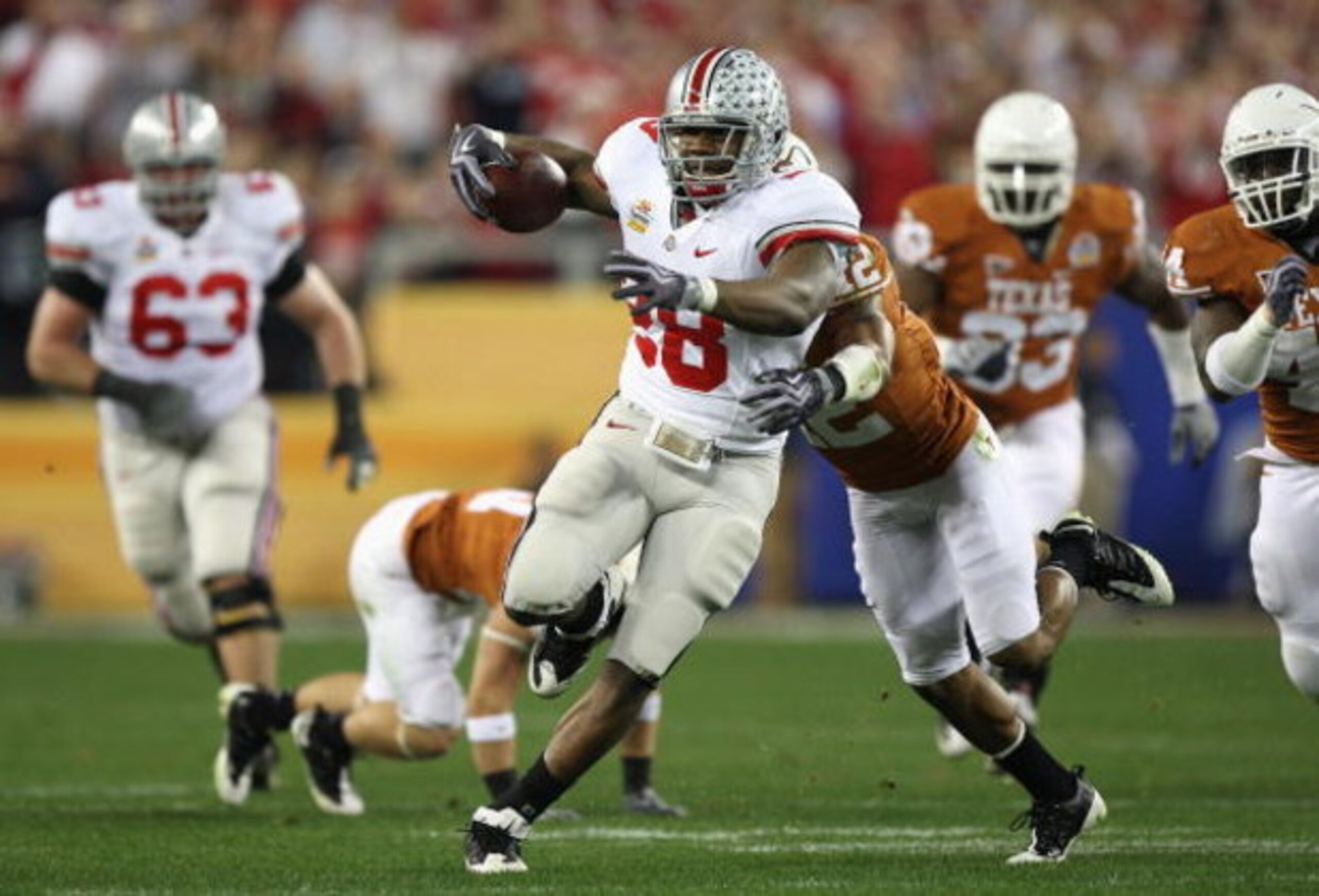 GLENDALE, AZ - JANUARY 05: Runningback Chris Wells #28 of the Ohio State Buckeyes rushes the ball against the Texas Longhorns during the Tostitos Fiesta Bowl Game on January 5, 2009 at University of Phoenix Stadium in Glendale, Arizona. (Photo by Jed Ja GLENDALE, AZ - JANUARY 05: Runningback Chris Wells #28 of the Ohio State Buckeyes rushes the ball against the Texas Longhorns during the Tostitos Fiesta Bowl Game on January 5, 2009 at University of Phoenix Stadium in Glendale, Arizona. (Photo by Jed Ja