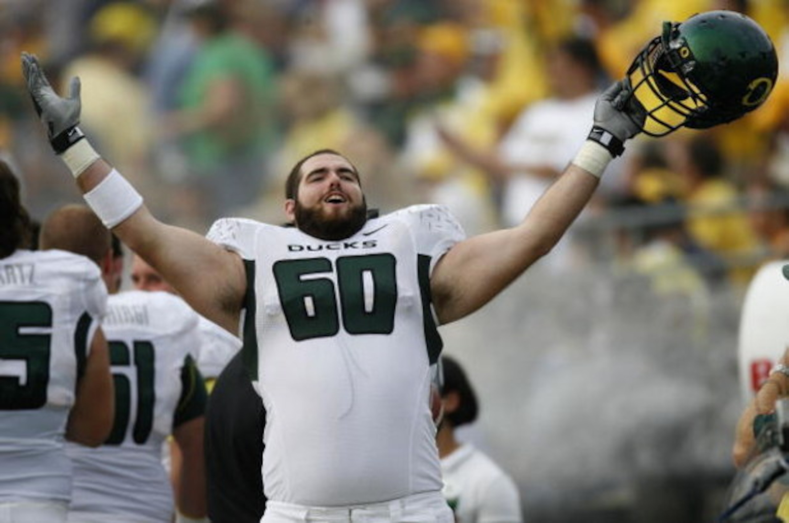 ANN ARBOR, MI - SEPTEMBER 08: Max Unger #60 of the Oregon Ducks celebrates on the sideline late in the fourth quarter against the Michigan Wolverines on September 8, 2007 at Michigan Stadium in Ann Arbor, Michigan. Oregon won the game 39-7. (Photo By Gre ANN ARBOR, MI - SEPTEMBER 08: Max Unger #60 of the Oregon Ducks celebrates on the sideline late in the fourth quarter against the Michigan Wolverines on September 8, 2007 at Michigan Stadium in Ann Arbor, Michigan. Oregon won the game 39-7. (Photo By Gre