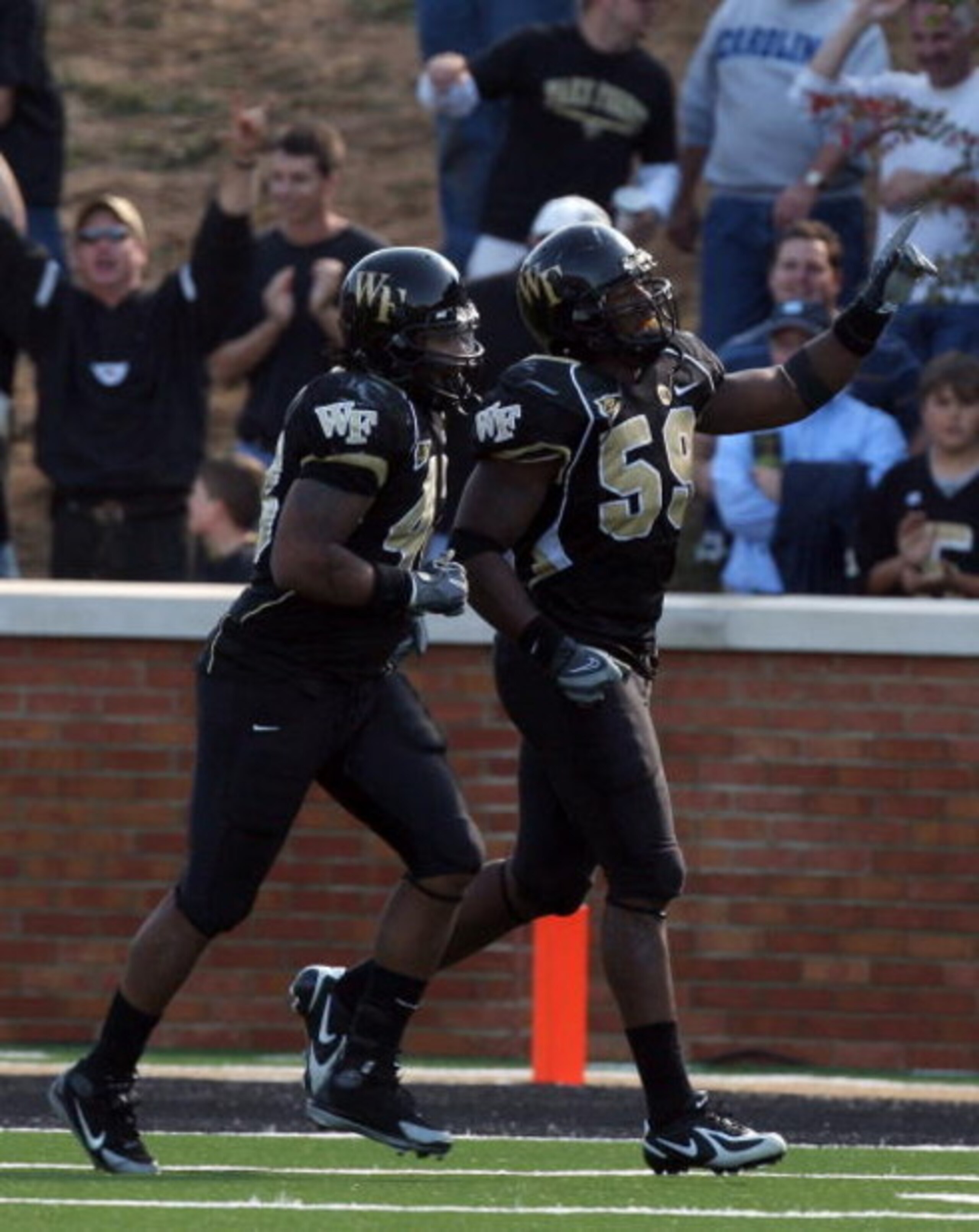 WINSTON SALEM, NC - OCTOBER 27: Aaron Curry #59 of the Wake Forest Demon Deacons celebrates his touchdown against the UNC Tar Heels during the ACC game at the Groves Stadium on October 27, 2007 in Winston Salem,North Carolina. (Photo by David Cannon/Get WINSTON SALEM, NC - OCTOBER 27: Aaron Curry #59 of the Wake Forest Demon Deacons celebrates his touchdown against the UNC Tar Heels during the ACC game at the Groves Stadium on October 27, 2007 in Winston Salem,North Carolina. (Photo by David Cannon/Get