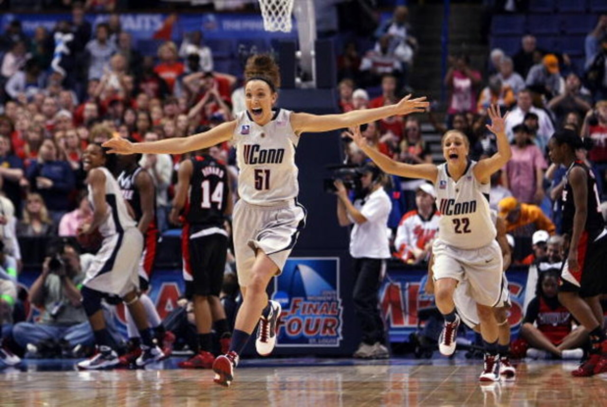 ST. LOUIS - APRIL 07: Cassie Kerns #51 and Meghan Gardler #22 of the Connecticut Huskies celebrate the win at the buzzer during the NCAA Women's Final Four Championship game against the Louisville Cardinals at the Scottrade Center on April 7, 2009 in St ST. LOUIS - APRIL 07: Cassie Kerns #51 and Meghan Gardler #22 of the Connecticut Huskies celebrate the win at the buzzer during the NCAA Women's Final Four Championship game against the Louisville Cardinals at the Scottrade Center on April 7, 2009 in St