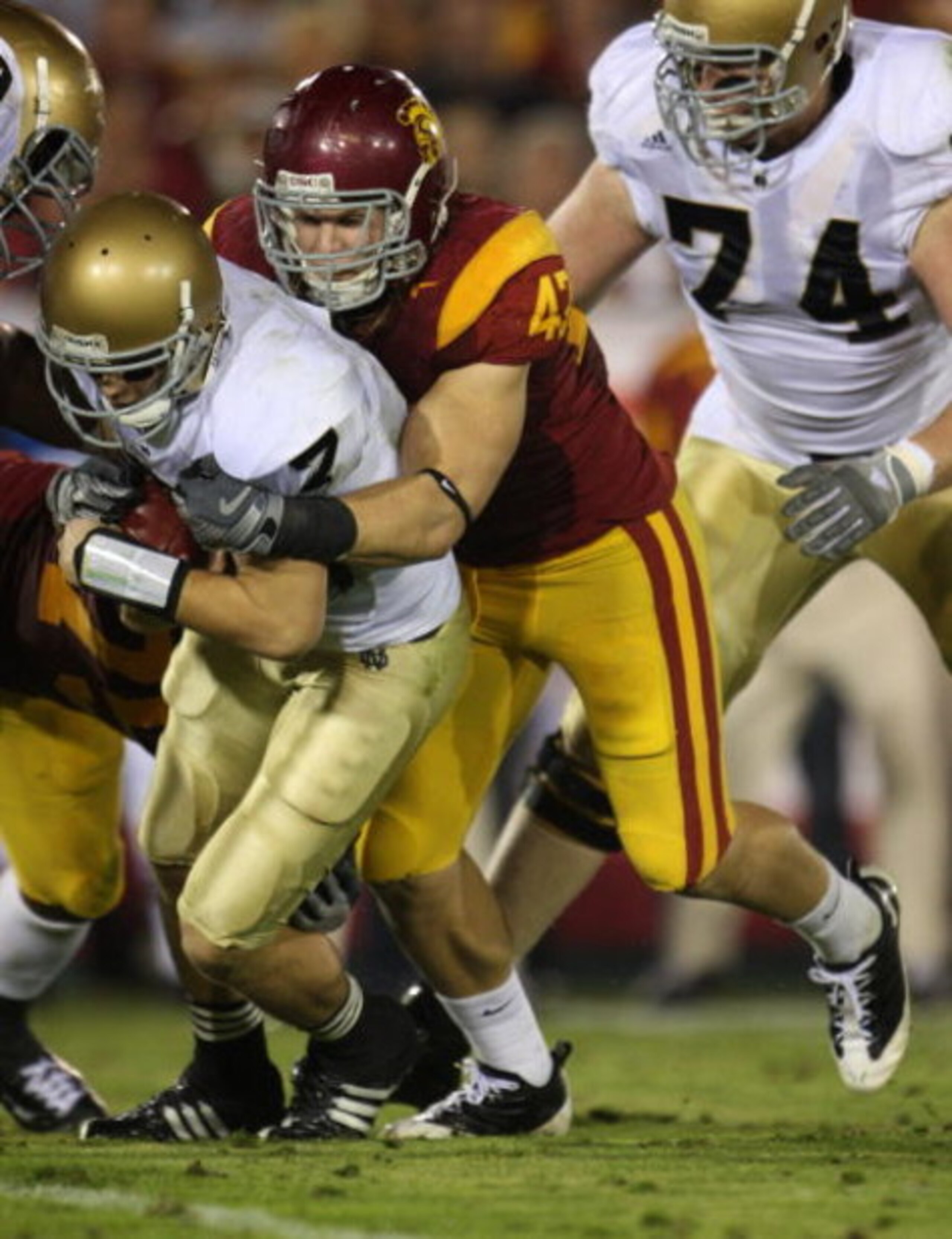 LOS ANGELES, CA - NOVEMBER 29: Quarterback Jimmy Clausen #7 of the Notre Dame Fighting Irish is sacked by Clay Matthews #47 of the USC Trojans during the first half at the Memorial Coliseum on November 29, 2008 in Los Angeles, California. (Photo by Jef LOS ANGELES, CA - NOVEMBER 29: Quarterback Jimmy Clausen #7 of the Notre Dame Fighting Irish is sacked by Clay Matthews #47 of the USC Trojans during the first half at the Memorial Coliseum on November 29, 2008 in Los Angeles, California. (Photo by Jef
