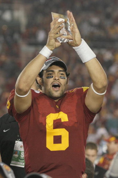 PASADENA, CA - JANUARY 1:  Mark Sanchez #6 of the USC Trojans rejoices as he holds te Offensive Player of the Game Trophy after the game against the Penn State Nittany Lions on January 1, 2009 at the Rose Bowl in Pasadena, California.  USC won 38-24.  (Ph