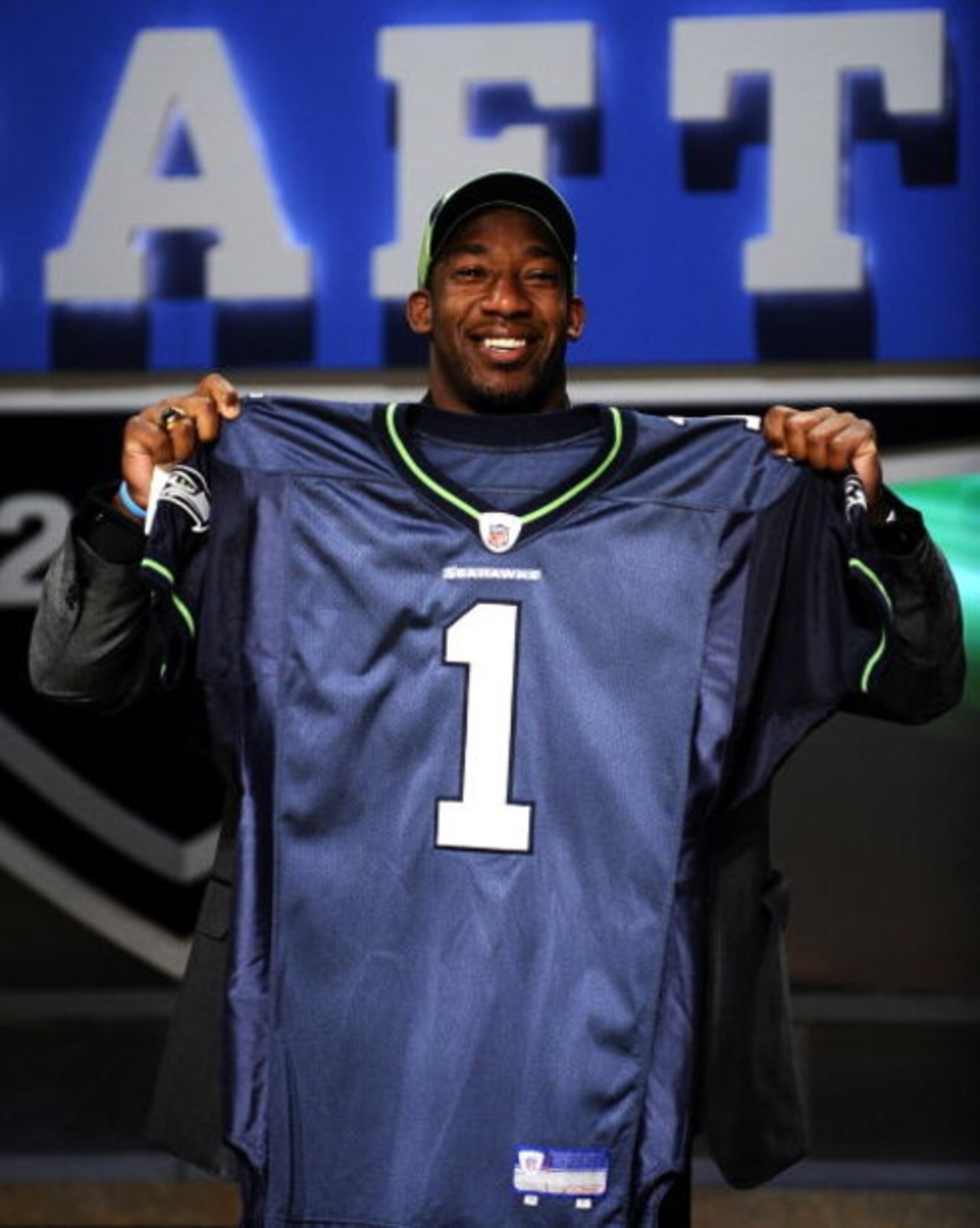 NEW YORK - APRIL 25: Seattle Seahawks draft pick Aaron Curry poses with his new jersey at Radio City Music Hall for the 2009 NFL Draft on April 25, 2009 in New York City (Photo by Jeff Zelevansky/Getty Images) NEW YORK - APRIL 25: Seattle Seahawks draft pick Aaron Curry poses with his new jersey at Radio City Music Hall for the 2009 NFL Draft on April 25, 2009 in New York City (Photo by Jeff Zelevansky/Getty Images)