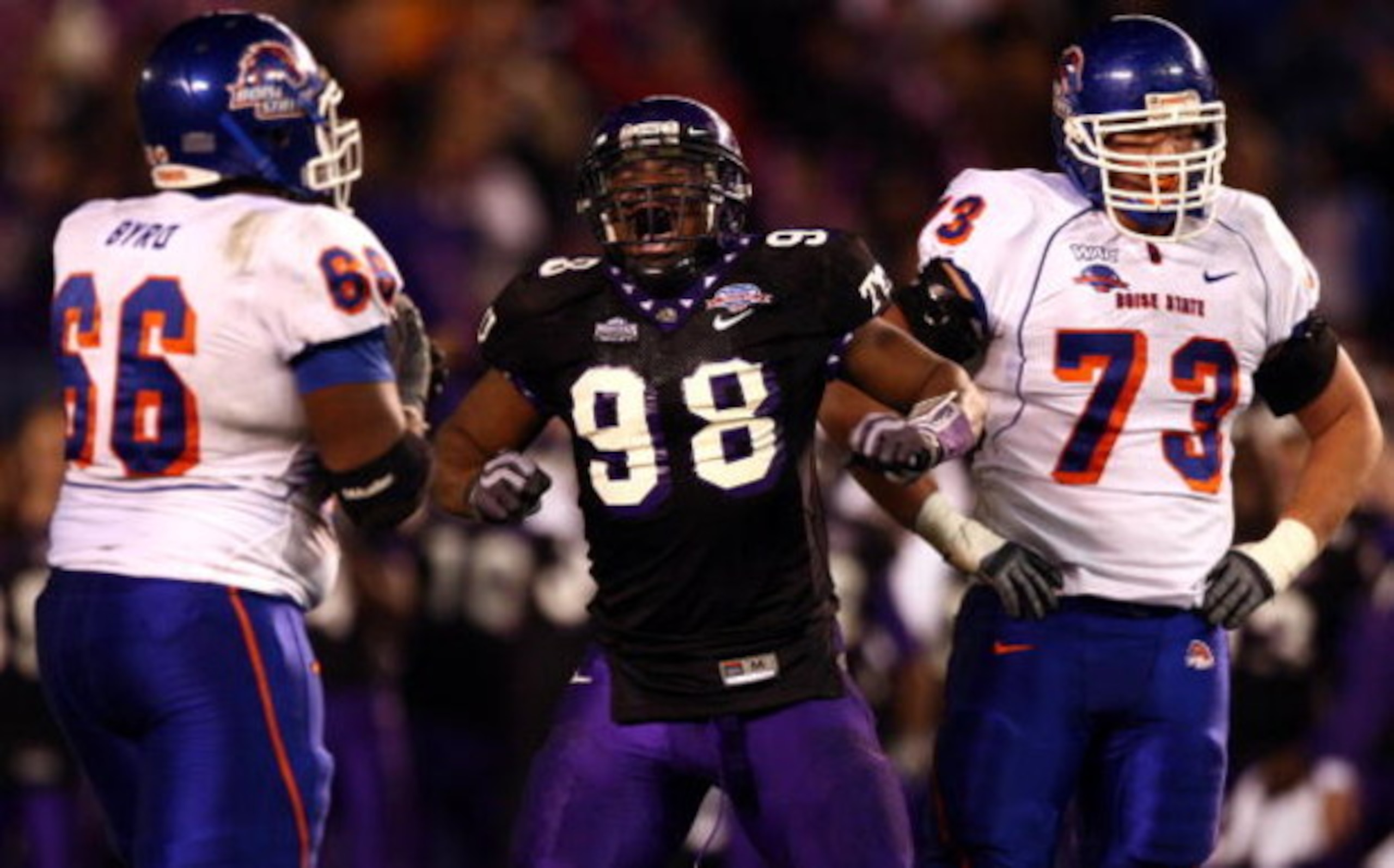 SAN DIEGO, CA - DECEMBER 23:  Defensive End Jerry Hughes #98 of the TCU Horned Frogs celebrates his sack Quarterback Kellen Moore #11 of Boise State Broncos during Frogs' 17-16 win over the Broncos in the San Diego County Credit Union Poinsettia Bowl at Q