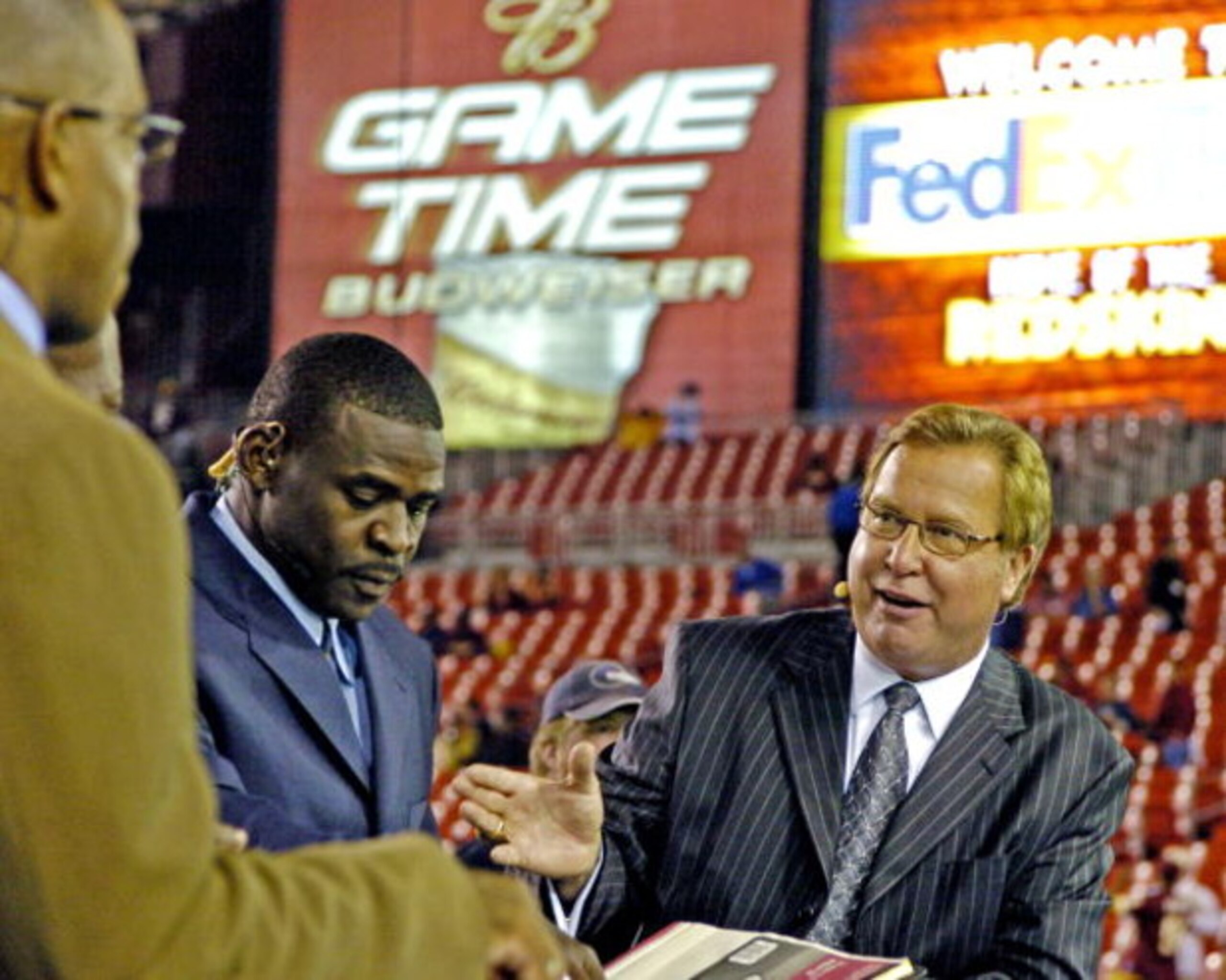 ESPN commentator Ron Jaworski  works the Dallas Cowboys  -   Washington Redskins  game  at FedEx Field, September 27, 2004 in Landover, Maryland. The Cowboys defeated the Redskins 21 to 18.  (Photo by Al Messerschmidt/Getty Images)