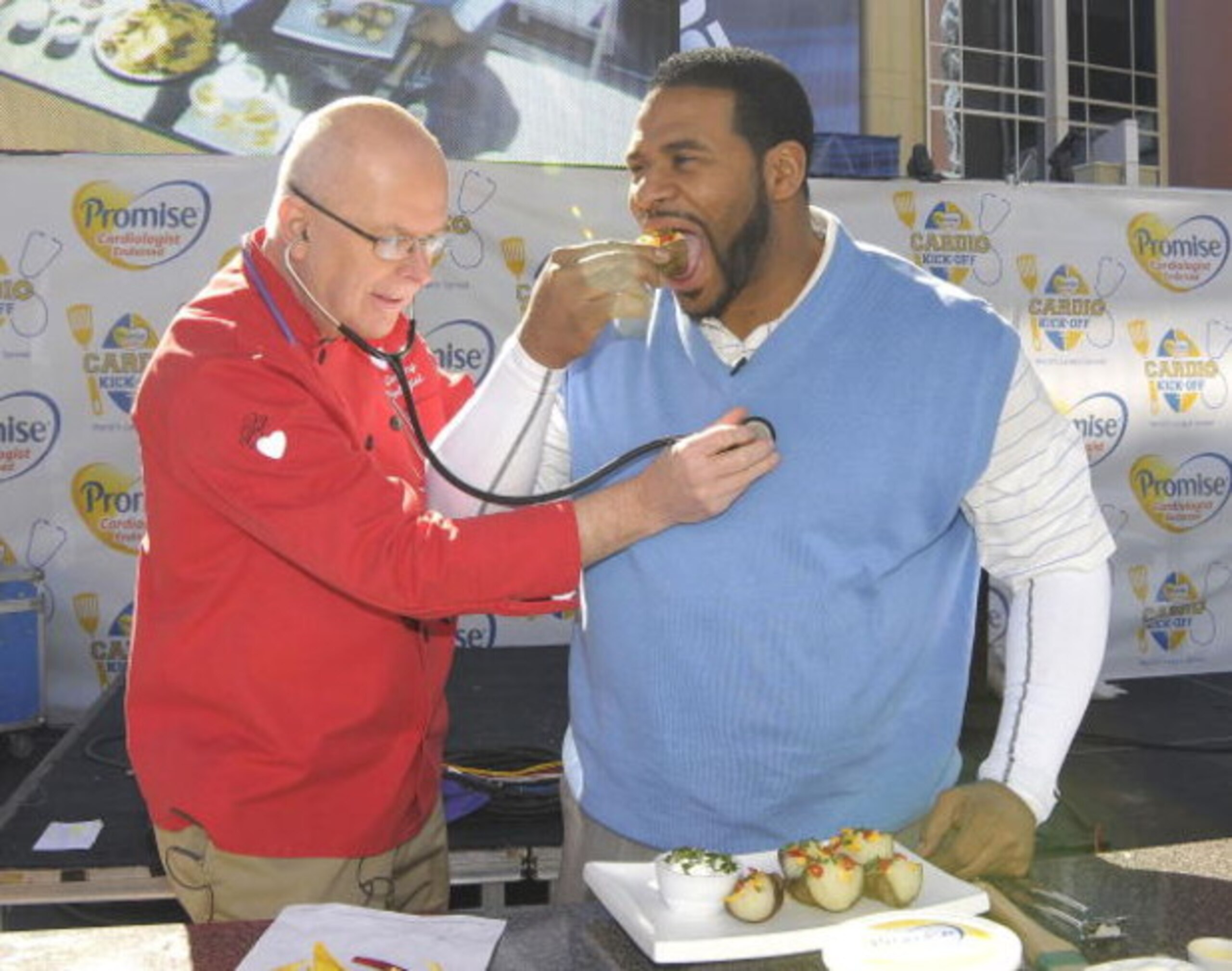 GLENDALE, AZ - JANUARY 31:  Former NFL running back Jerome Bettis (R) and the Cooking Cardiologist Dr. Richard Collins celebrate the Guinness Book of World Records 'World's Largest Spread' at the Promise Cardio Kick-Off held at the Westgate City Center on