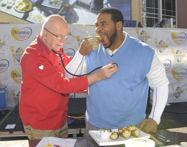 GLENDALE, AZ - JANUARY 31:  Former NFL running back Jerome Bettis (R) and the Cooking Cardiologist Dr. Richard Collins celebrate the Guinness Book of World Records 'World's Largest Spread' at the Promise Cardio Kick-Off held at the Westgate City Center on