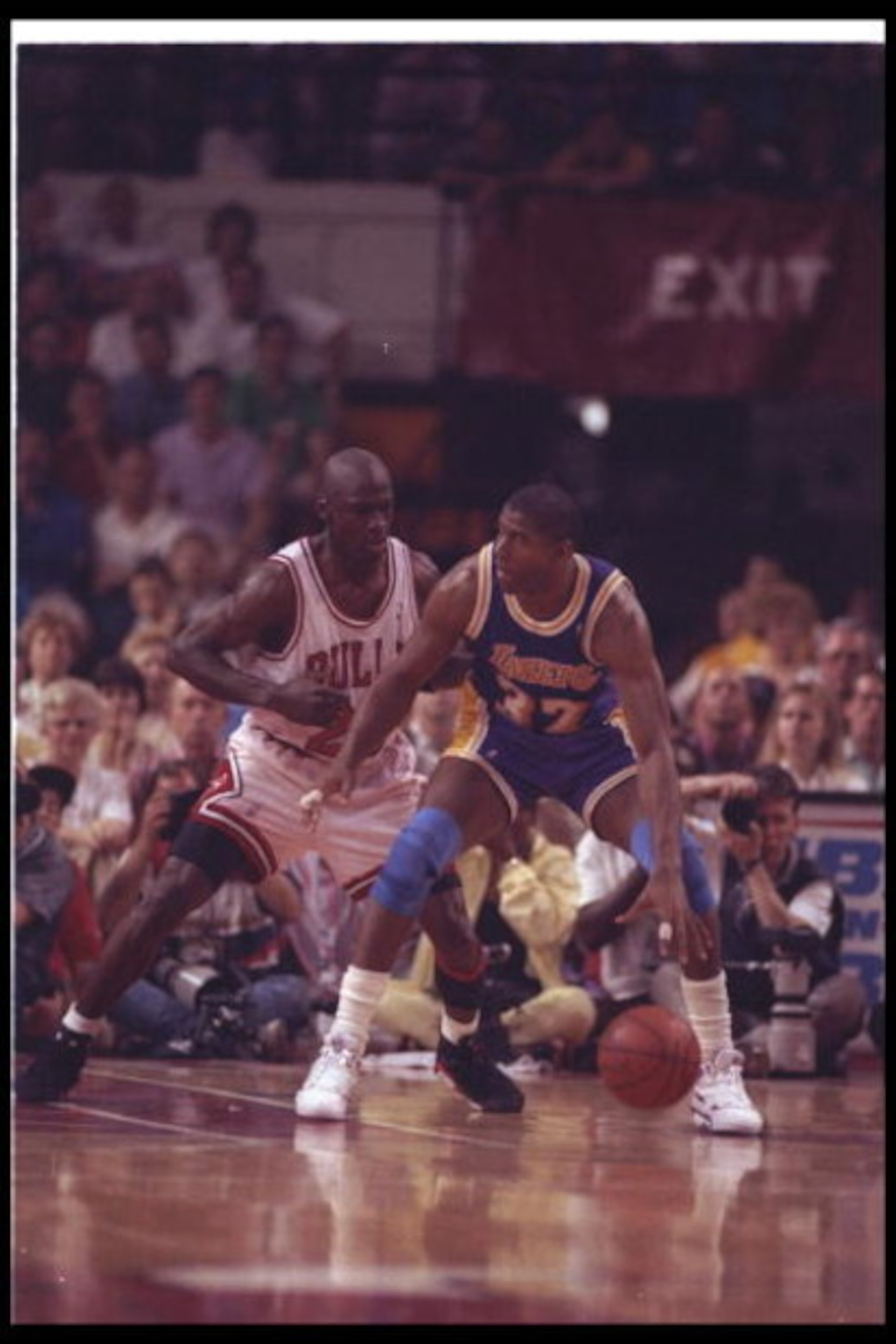 2 May 1991:  Guard Michael Jordan of the Chicago Bulls (left) and guard Magic Johnson of the Los Angeles Lakers fight for the ball during Game One of the NBA finals at the United Center in Chicago, Illinois.  The Lakers won the game, 93-91. Mandatory Cred
