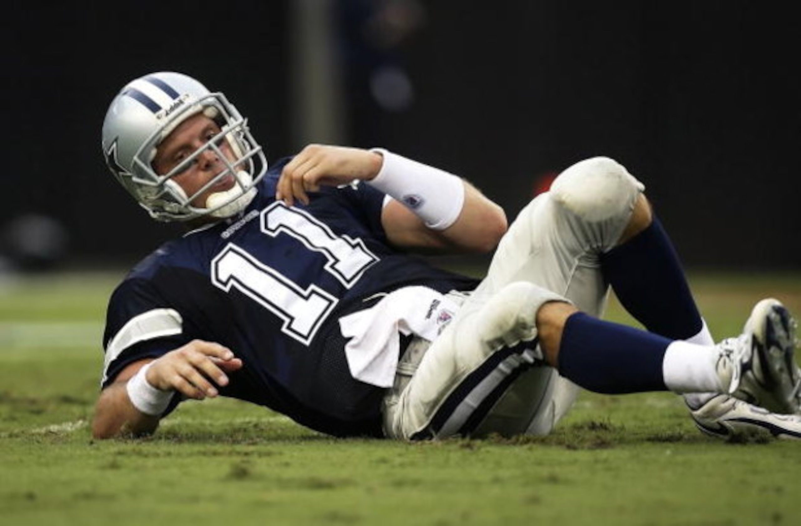 JACKSONVILLE, FL - SEPTEMBER 10:  Quarterback Drew Bledsoe #11 of the Dallas Cowboys gets up after being knocked down against the Jacksonville Jaguars at Alltel Stadium on September 10, 2006 in Jacksonville, Florida. The Jaguars defeated the Cowboys 24-17