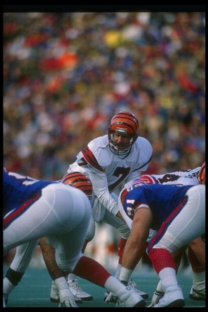 26 Nov 1989: Quarterback Boomer Esiason of the Cincinnati Bengals (center) stands behind center during a game against the Buffalo Bills at Rich Stadium in Orchard Park, New York. The Bills won the game, 24-7.