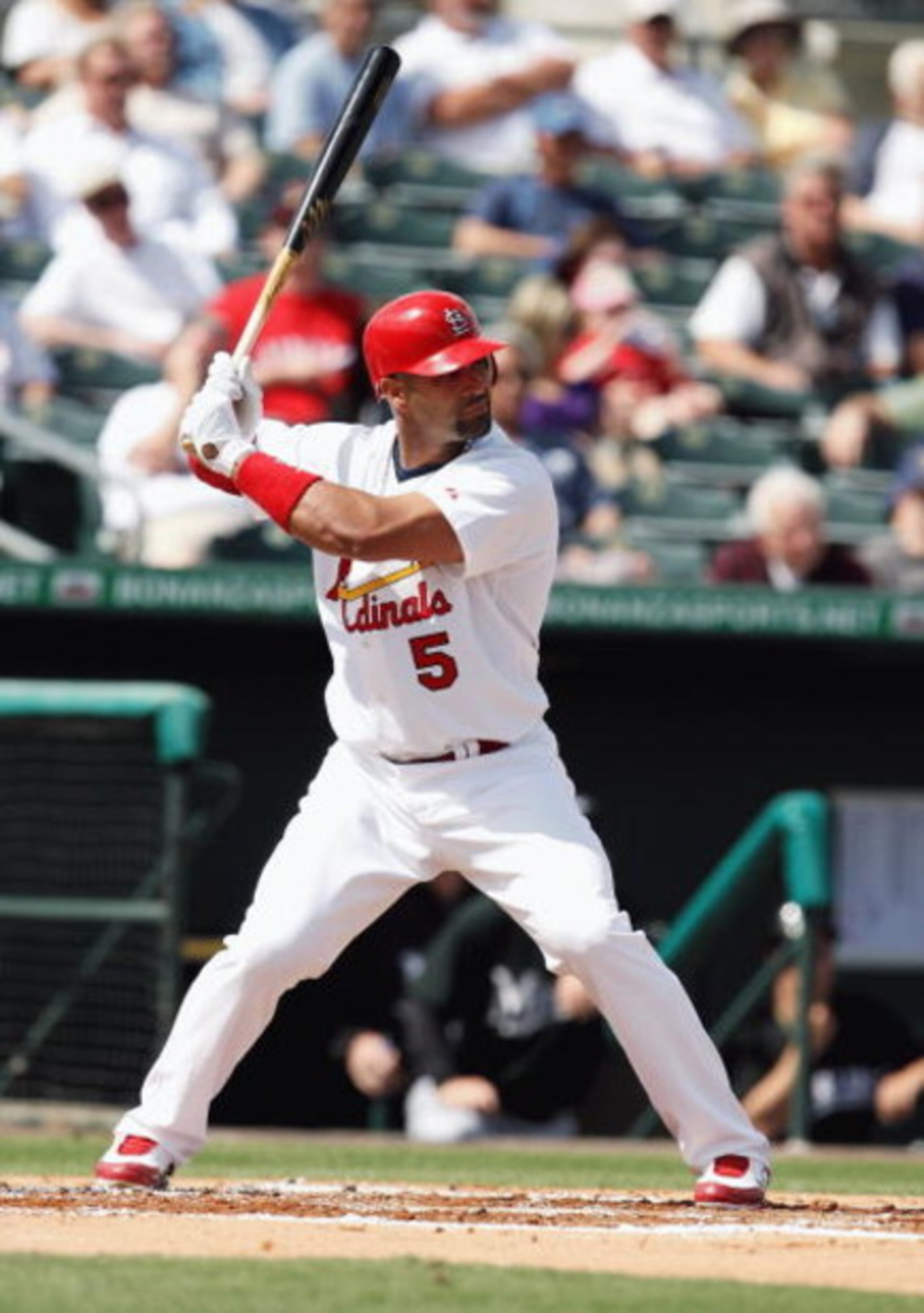 JUPITER, FL - FEBRUARY 25:  Albert Pujols #5 of the St. Louis Cardinals bats against the Florida Marlins during a spring training game at Roger Dean Stadium on February 25, 2009 in Jupiter, Florida. The Marlins and the Mets played to a 5-5 tie in 10 innin