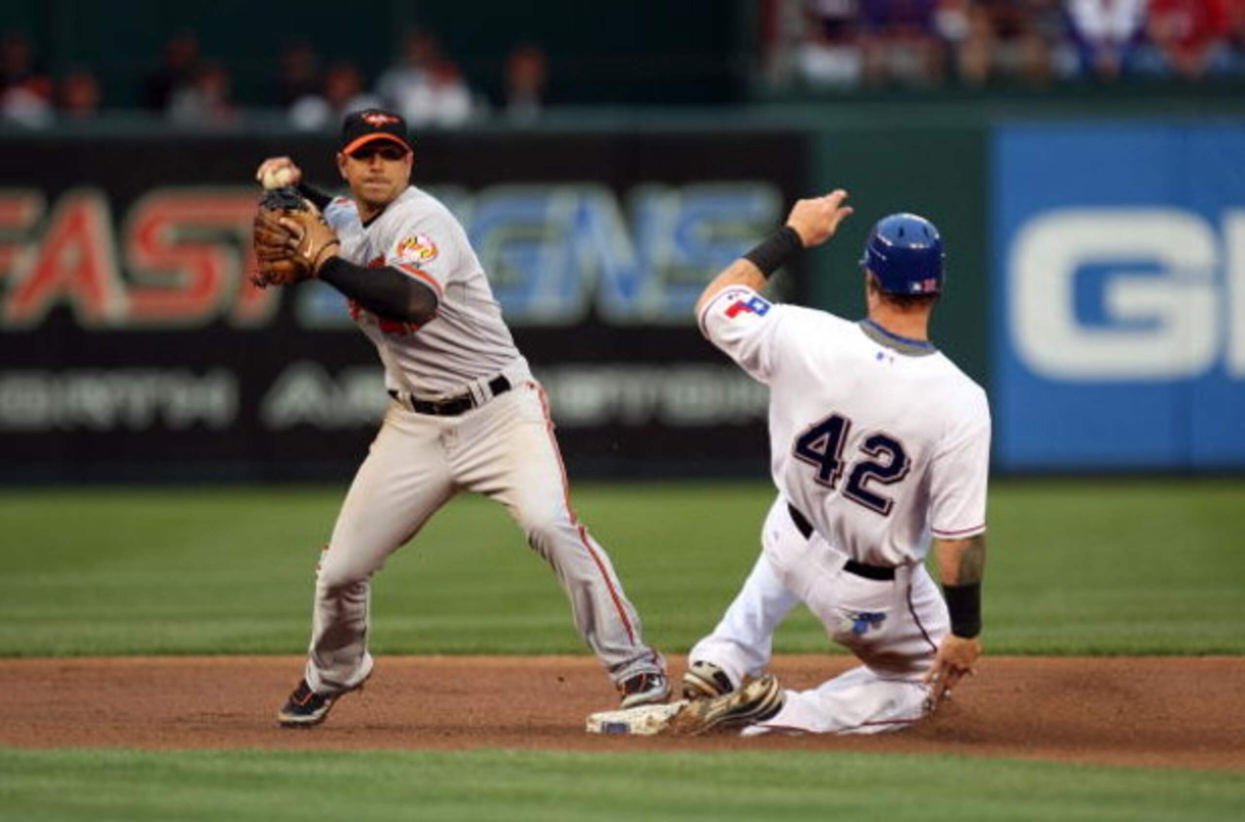 ARLINGTON, TX - APRIL 15: Second baseman Brian Roberts #1 of the Baltimore Orioles while wearing jersey #42 to commemorate Jackie Robinson day makes the out against Josh Hamilton of the Texas Rangers on April 15, 2009 at Rangers Ballpark in Arlington, Te ARLINGTON, TX - APRIL 15: Second baseman Brian Roberts #1 of the Baltimore Orioles while wearing jersey #42 to commemorate Jackie Robinson day makes the out against Josh Hamilton of the Texas Rangers on April 15, 2009 at Rangers Ballpark in Arlington, Te