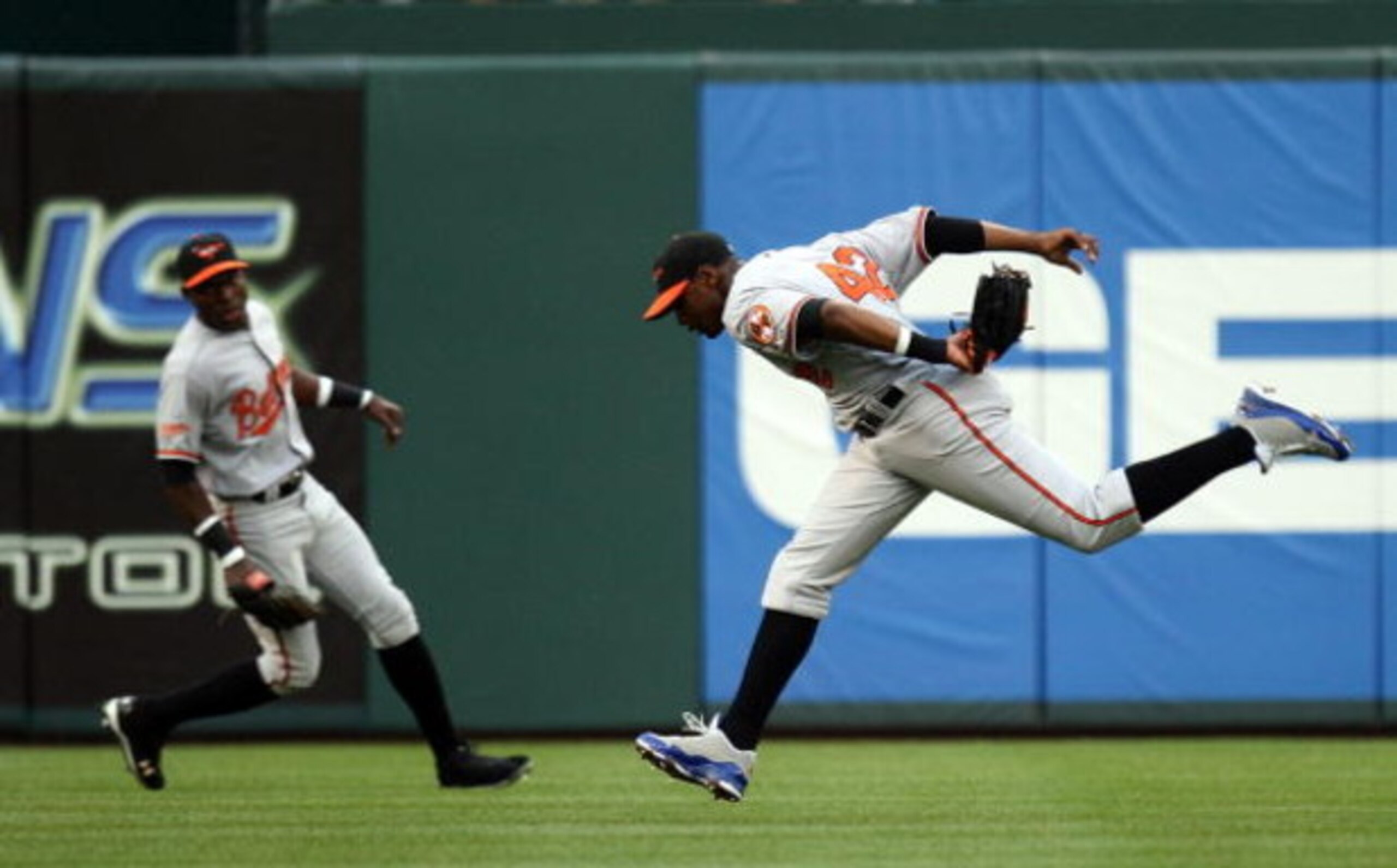 ARLINGTON, TX - APRIL 15: Centerfielder Adam Jones #10 of the Baltimore Orioles while wearing jersey #42 to commemorate Jackie Robinson day makes the fly out on Hank Blalock of the Texas Rangers on April 15, 2009 at Rangers Ballpark in Arlington, Texas. ARLINGTON, TX - APRIL 15: Centerfielder Adam Jones #10 of the Baltimore Orioles while wearing jersey #42 to commemorate Jackie Robinson day makes the fly out on Hank Blalock of the Texas Rangers on April 15, 2009 at Rangers Ballpark in Arlington, Texas.