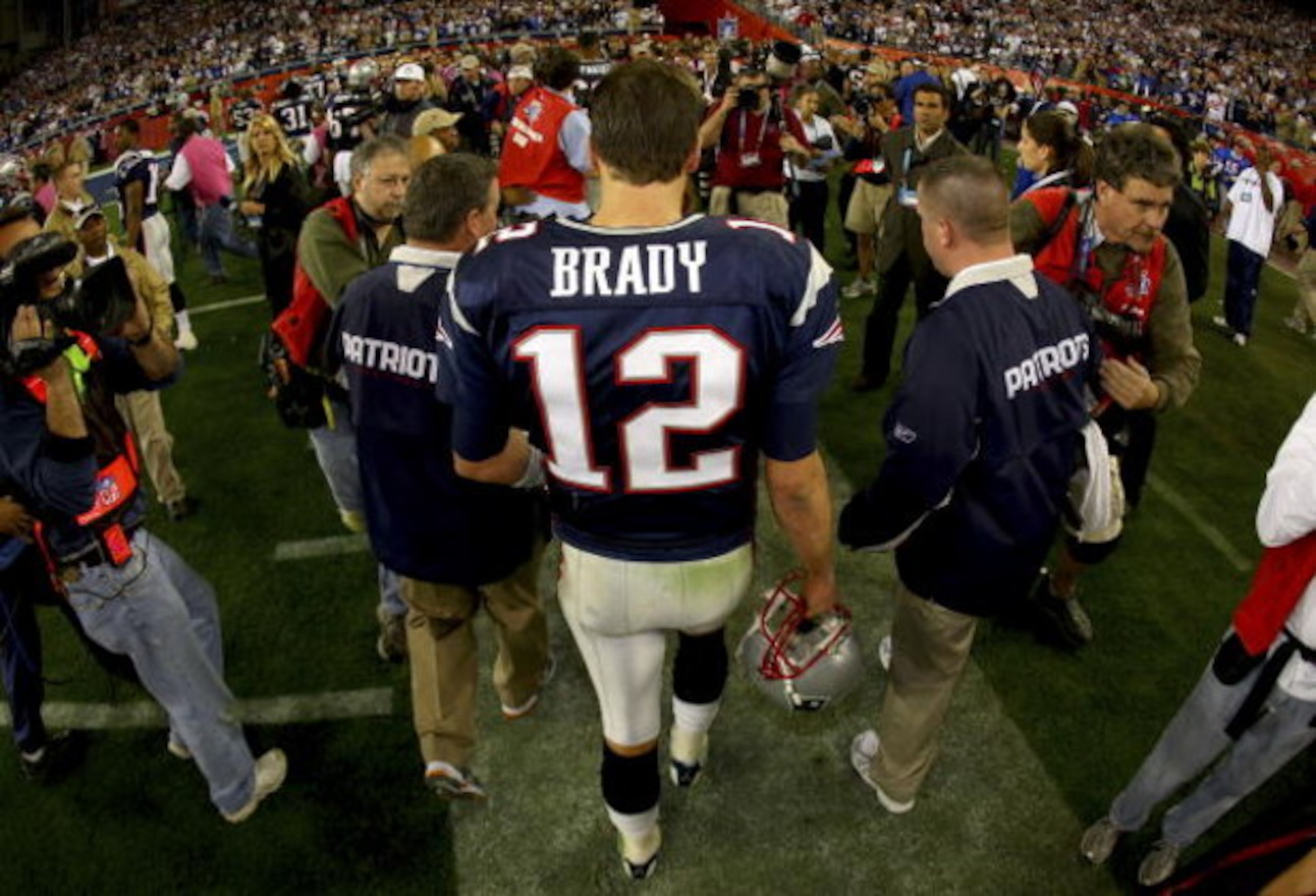 GLENDALE, AZ - FEBRUARY 03:  Quarterback Tom Brady #12 of the New England Patriots walks off the field after losing to the New York Giants 17-14 during Super Bowl XLII on February 3, 2008 at the University of Phoenix Stadium in Glendale, Arizona.  (Photo 