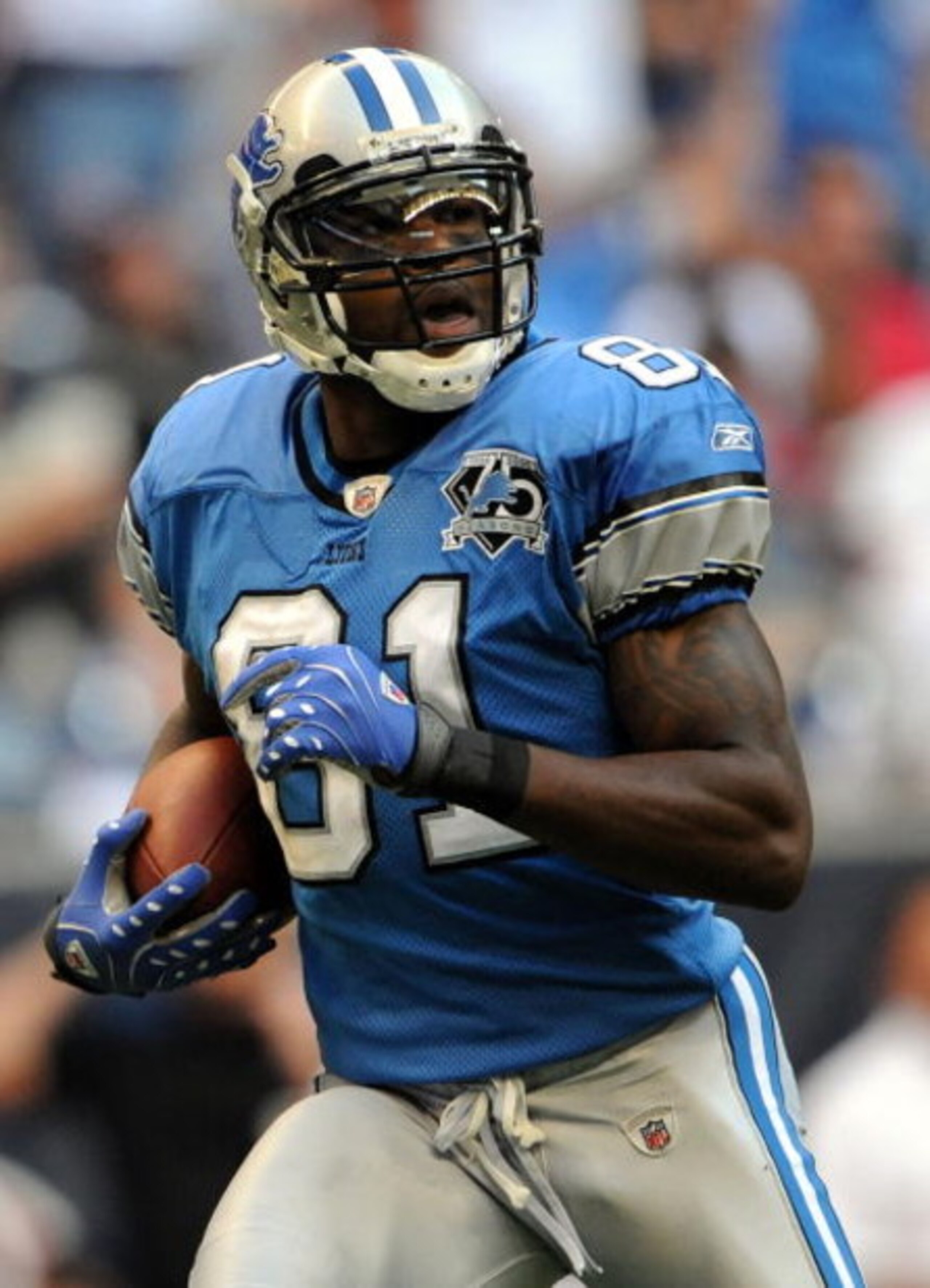 HOUSTON - OCTOBER 19:  Wide receiver Calvin Johnson #81 of the Detroit Lions makes a touchdown pass reception against the Houston Texans at Reliant Stadium on October 19, 2008 in Houston, Texas.  (Photo by Ronald Martinez/Getty Images)