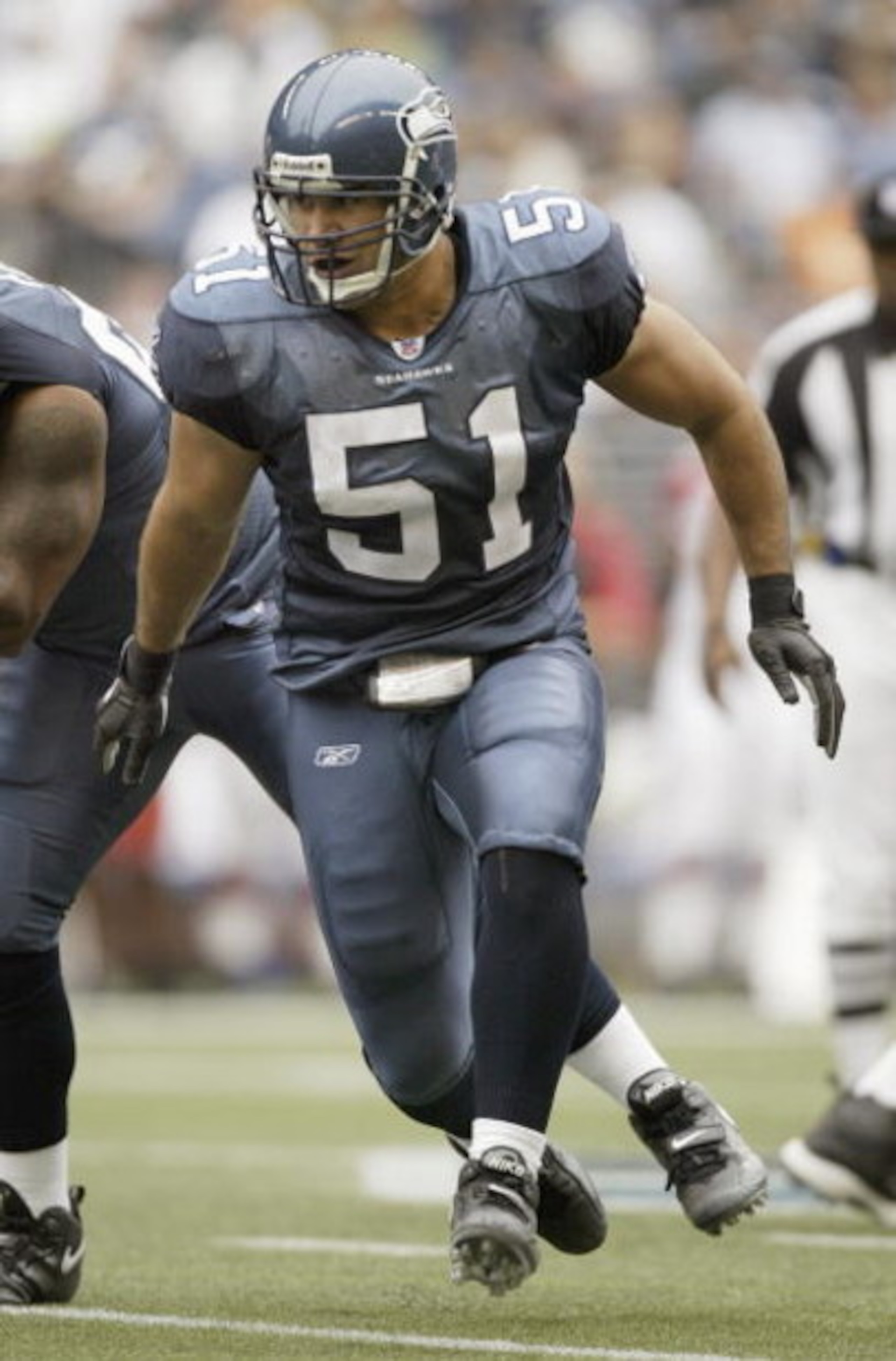 SEATTLE - SEPTEMBER 17:  Linebacker Lofa Tatupu #51 of the Seattle Seahawks runs against the Arizona Cardinals at Qwest Field on September 17, 2006 in Seattle, Washington. The Seahawks won 21-10. (Photo by Otto Greule Jr/Getty Images) 