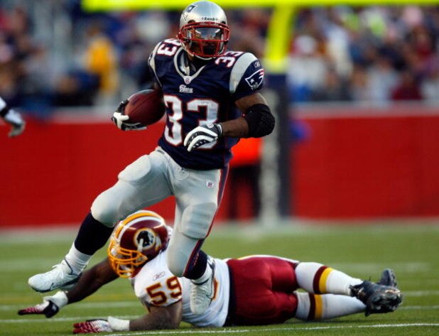 FOXBORO, MA - OCTOBER 28:  Kevin Faulk #33 of the New England Patriots carries the ball as London Fletcher #59 of the Washington Redskins misses the tackle on October 28, 2007 at Gillette Stadium in Foxboro, Massachusetts.  (Photo by Jim Rogash/Getty Imag