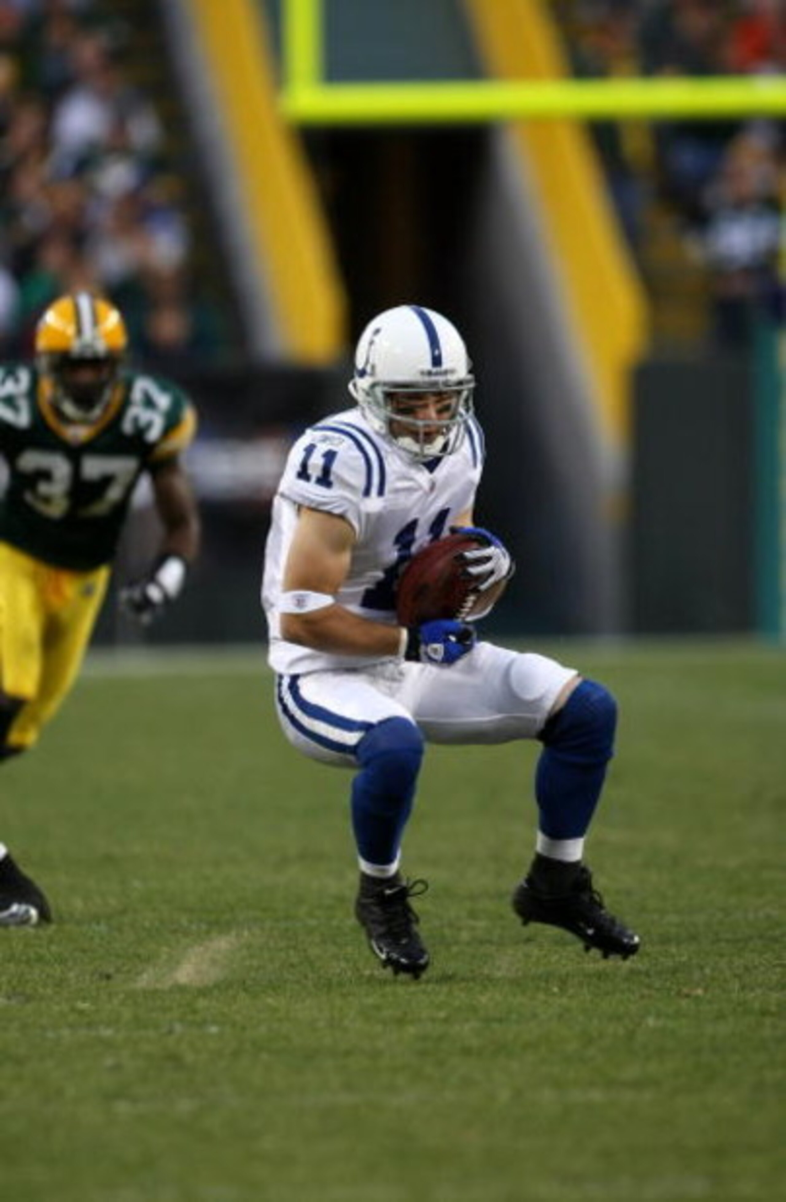 GREEN BAY, WI - OCTOBER 19:  Wide receiver Anthony Gonzalez  #11 of the Indianapolis Colts makes a catch against the Green Bay Packers on October 19, 2008 at Lambeau Field in Green Bay Wisconsin. The Packers won 34-14.  (Photo by Stephen Dunn/Getty Images