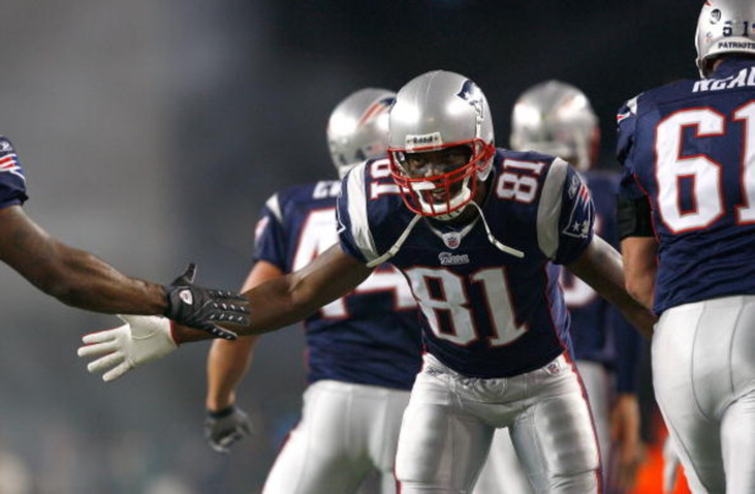 FOXBORO, MA - OCTOBER 20: Randy Moss #81 the New England Patriots celebrates a touchdown by teammate Sammy Morris #34 against the Denver Broncos at Gillette Stadium on October 20, 2008 in Foxboro, Massachusetts. (Photo by Jim Rogash/Getty Images)