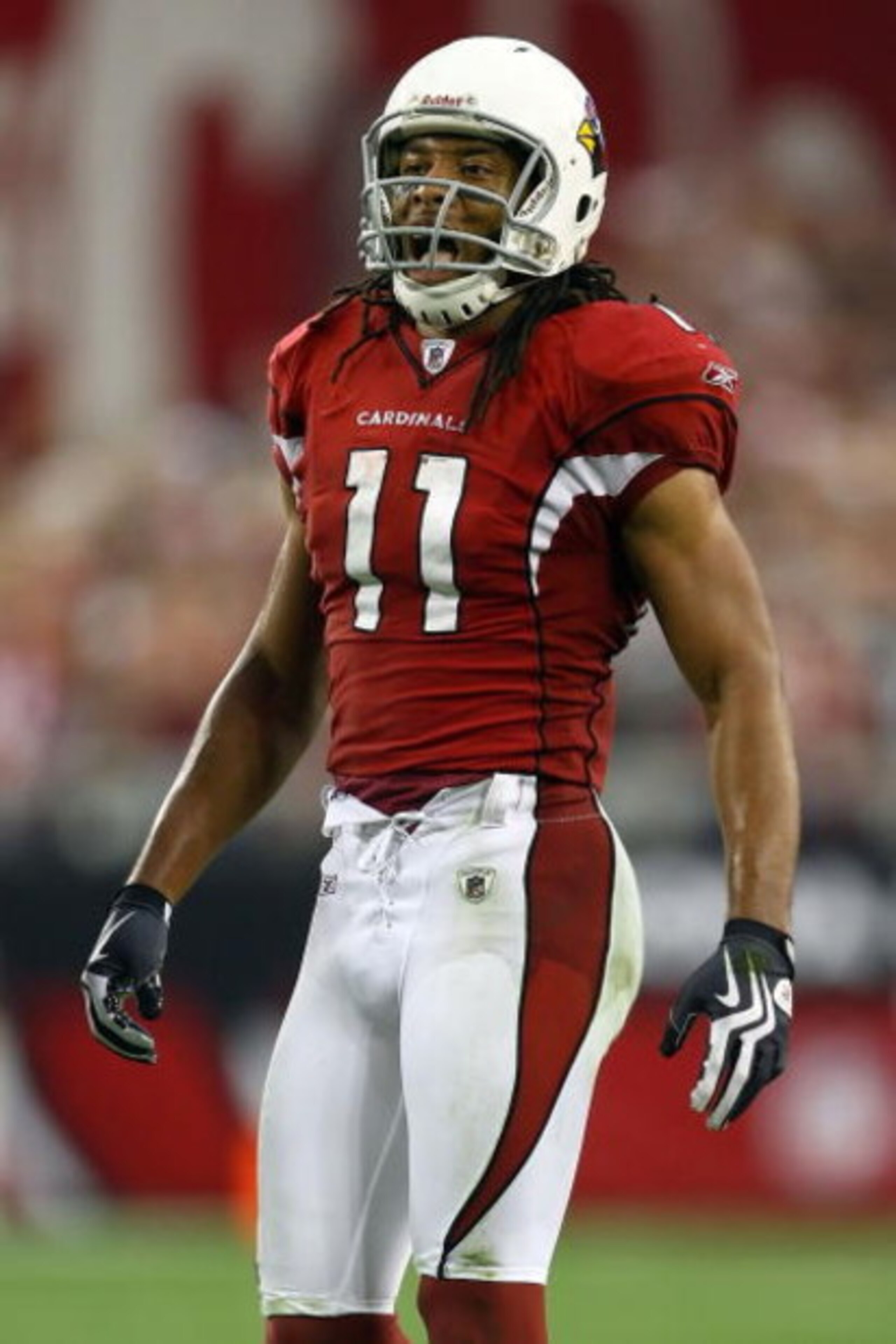 GLENDALE, AZ - JANUARY 18:  Wide receiver Larry Fitzgerald #11 of the Arizona Cardinals reacts after teammate Tim Hightower #34 scored a touchdown in the fourth quarter against the Philadelphia Eagles during the NFC championship game on January 18, 2009 a