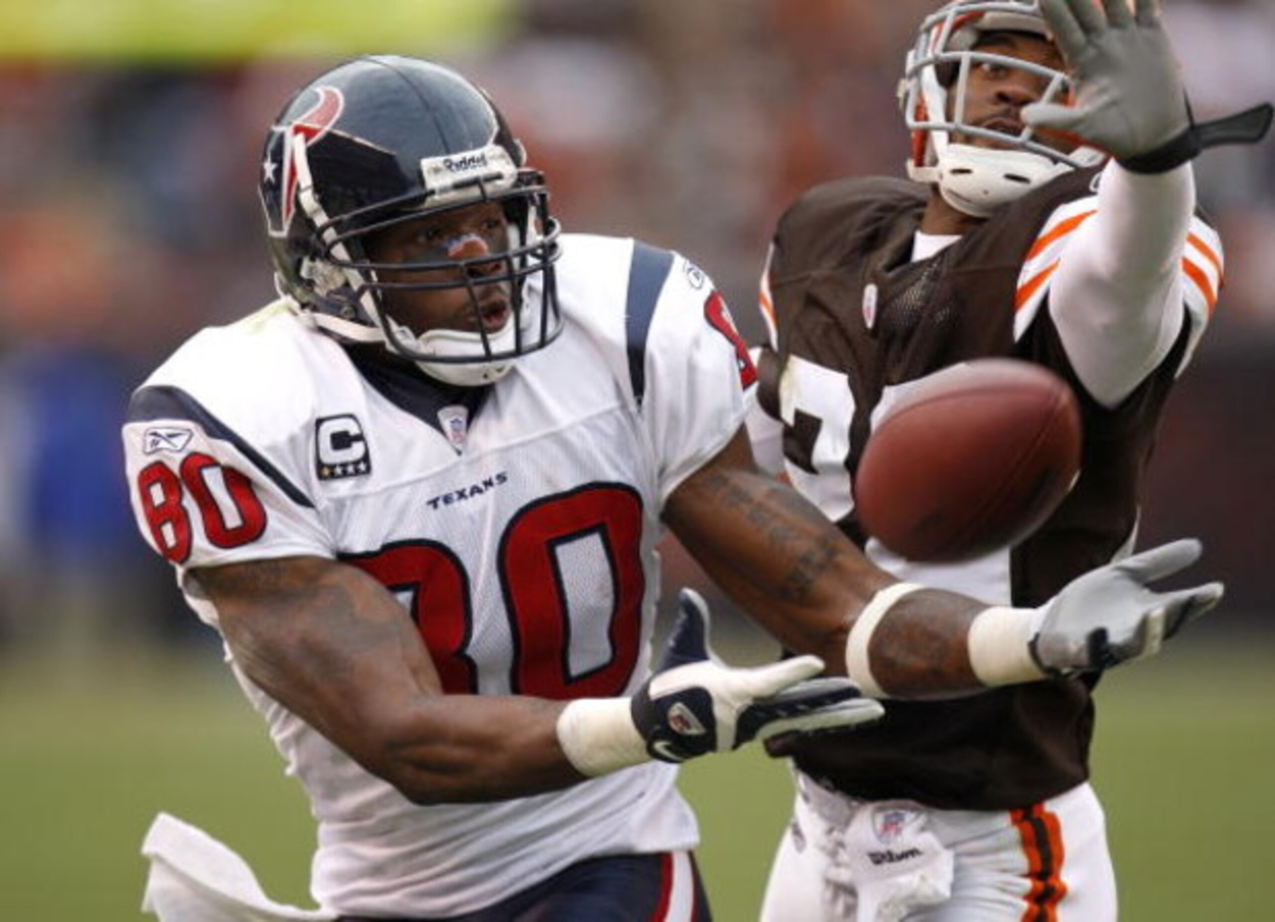 CLEVELAND - NOVEMBER 25:  Andre Johnson #80 of the Houston Texans can't come up with this fourth quarter catch in front of Brandon McDonald #22 of the Cleveland Browns on November 25, 2007 at Cleveland Browns Stadium in Cleveland, Ohio. Cleveland won the 