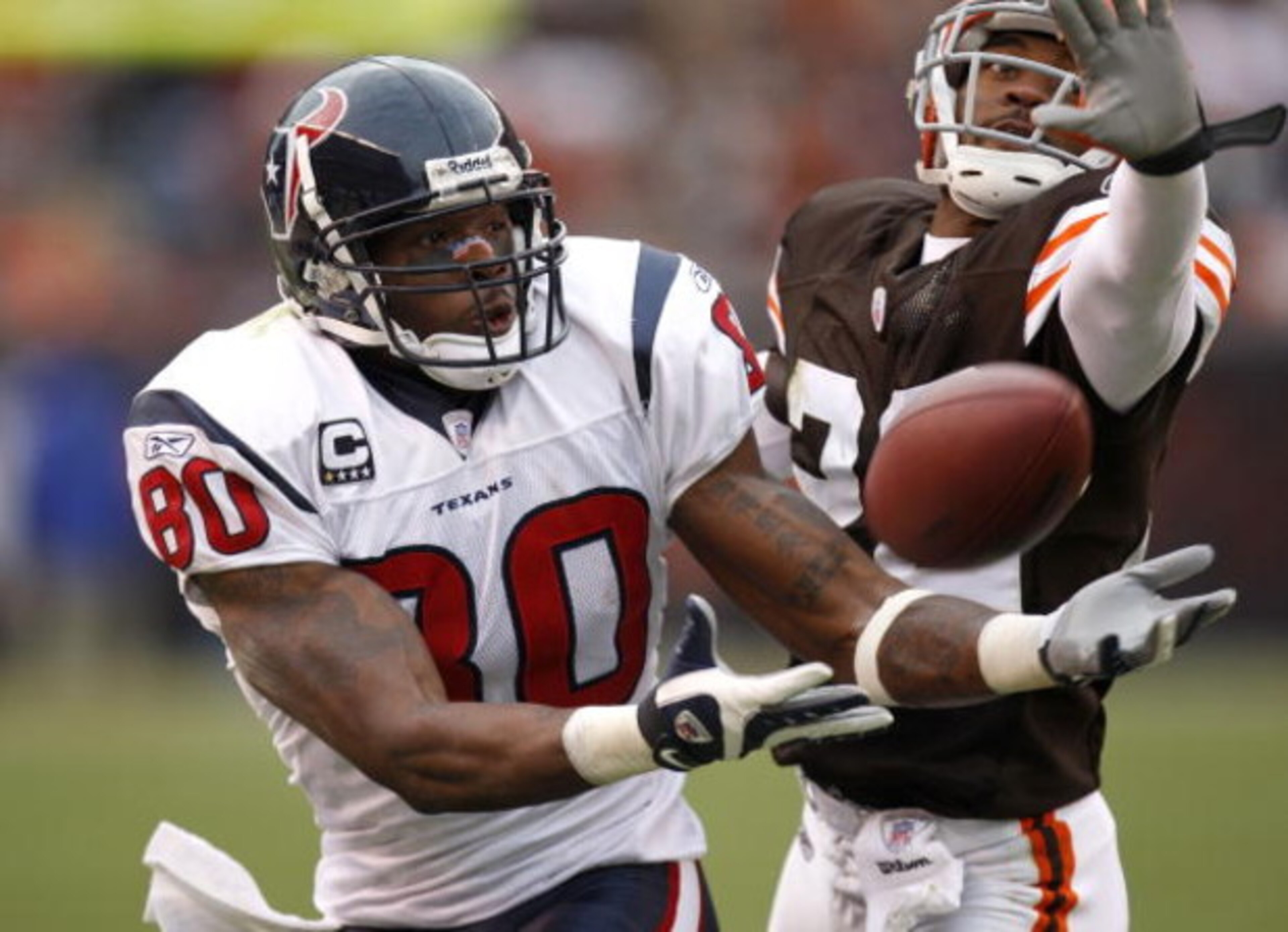 CLEVELAND - NOVEMBER 25:  Andre Johnson #80 of the Houston Texans can't come up with this fourth quarter catch in front of Brandon McDonald #22 of the Cleveland Browns on November 25, 2007 at Cleveland Browns Stadium in Cleveland, Ohio. Cleveland won the 
