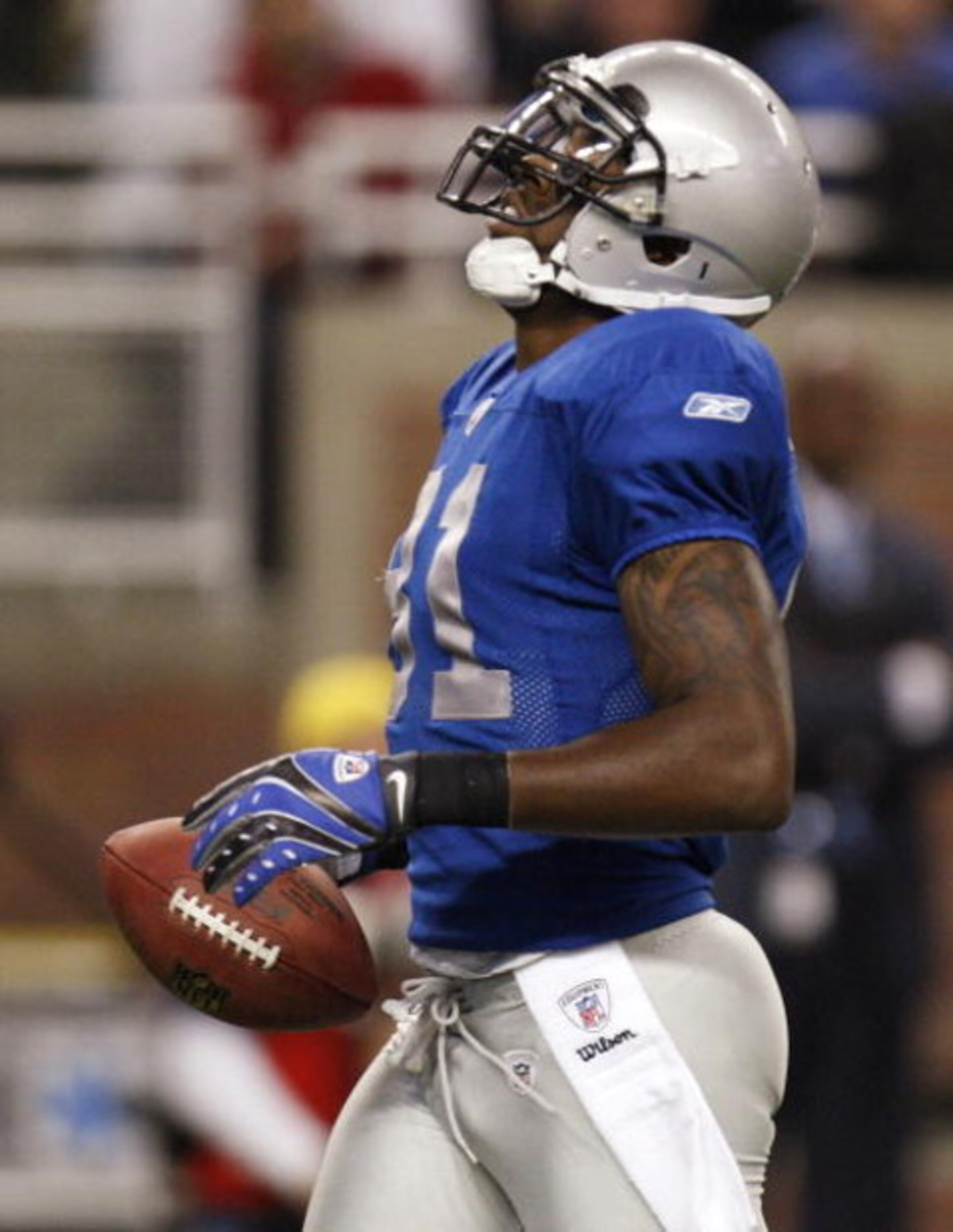 DETROIT , MI - NOVEMBER 27:  Calvin Johnson #81 of the Detroit Lions reacts after dropping a first quarter pass while playing the Tennessee Titans on November 27, 2008 at Ford Field in Detroit, Michigan.  (Photo by Gregory Shamus/Getty Images)