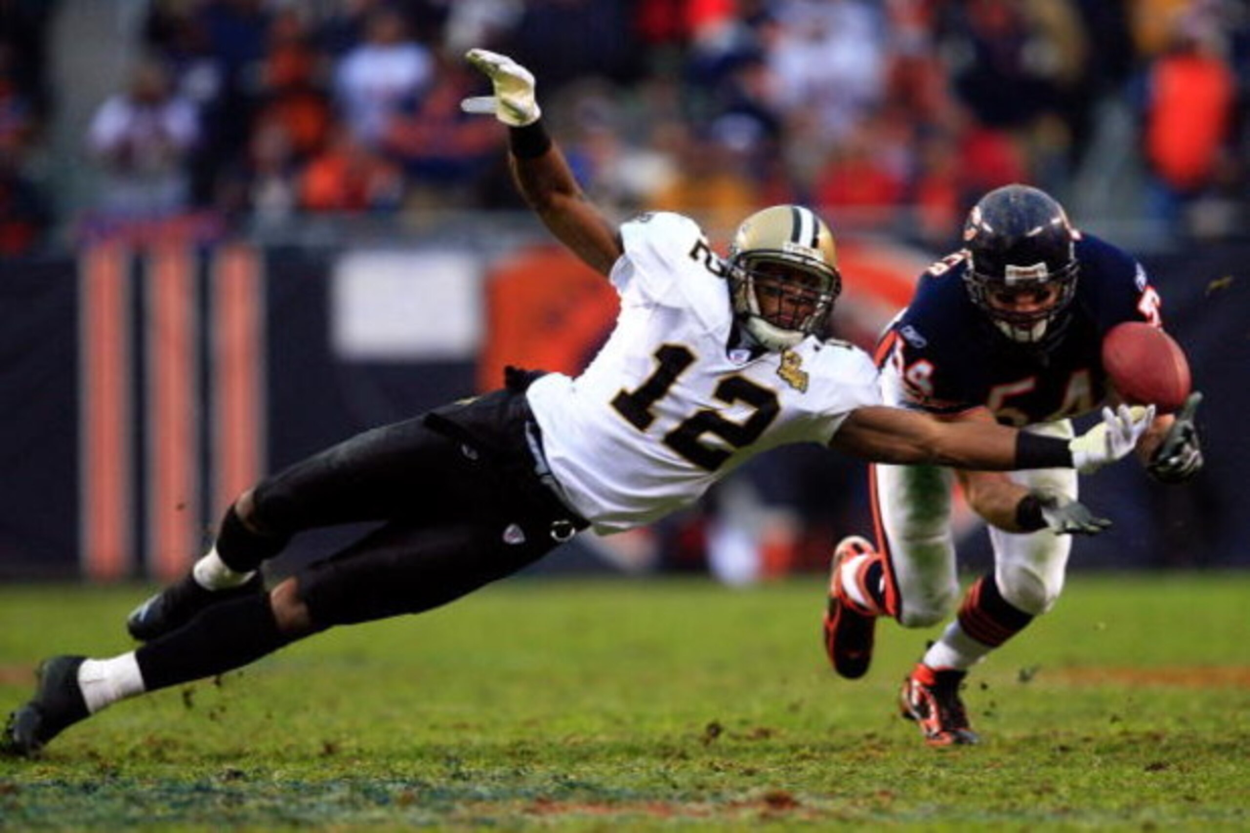 CHICAGO - JANUARY 21:  Brian Urlacher #54 of the Chicago Bears breaks up a pass intended for Marques Colston #12 of the New Orleans Saints during the NFC Championship Game on January 21, 2007 at Soldier Field in Chicago, Illinois.  (Photo by Jamie Squire/