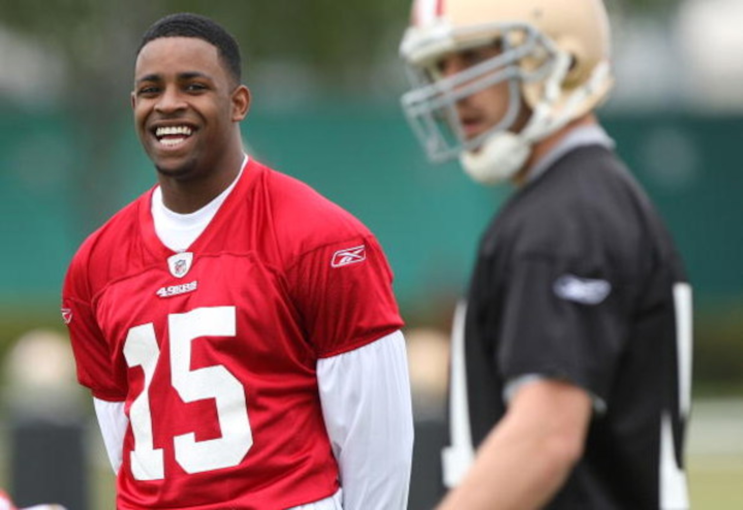 SANTA CLARA, CA - MAY 01:  Michael Crabtree #15 of the San Francisco 49ers looks on during practice as quaterback Alex Smith #11 practices during the 49ers Minicamp at their training facilities on May 1, 2009 in Santa Clara, California. Crabtree was the 4