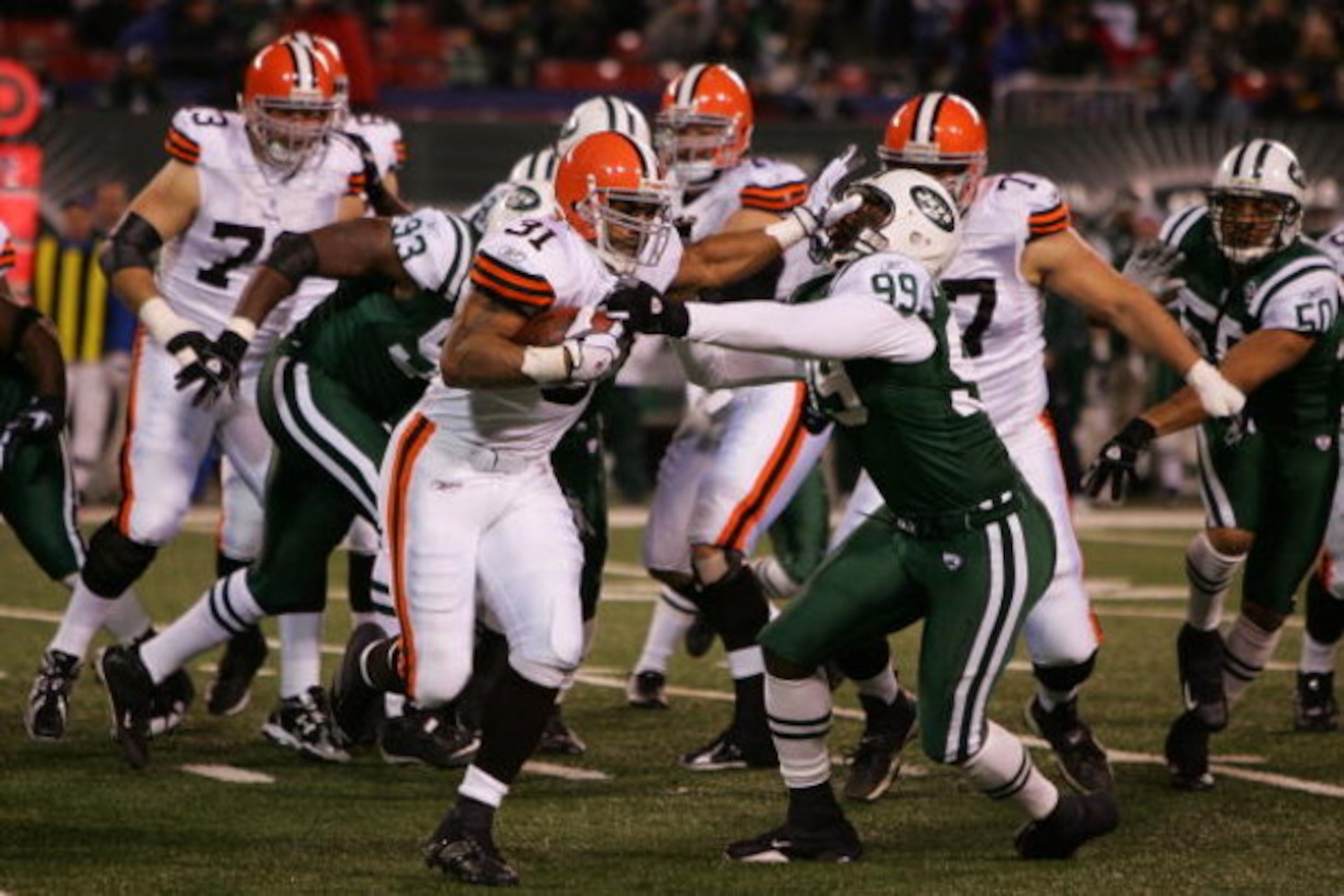 EAST RUTHERFORD, NJ - DECEMBER 09:  Jamal Lewis #31 of the Cleveland Browns stiff arms Bryan Thomas #99 of the New York Jets on December 9, 2007 at Giants Stadium in East Rutherford, New Jersey.  (Photo by Jim McIsaac/Getty Images)