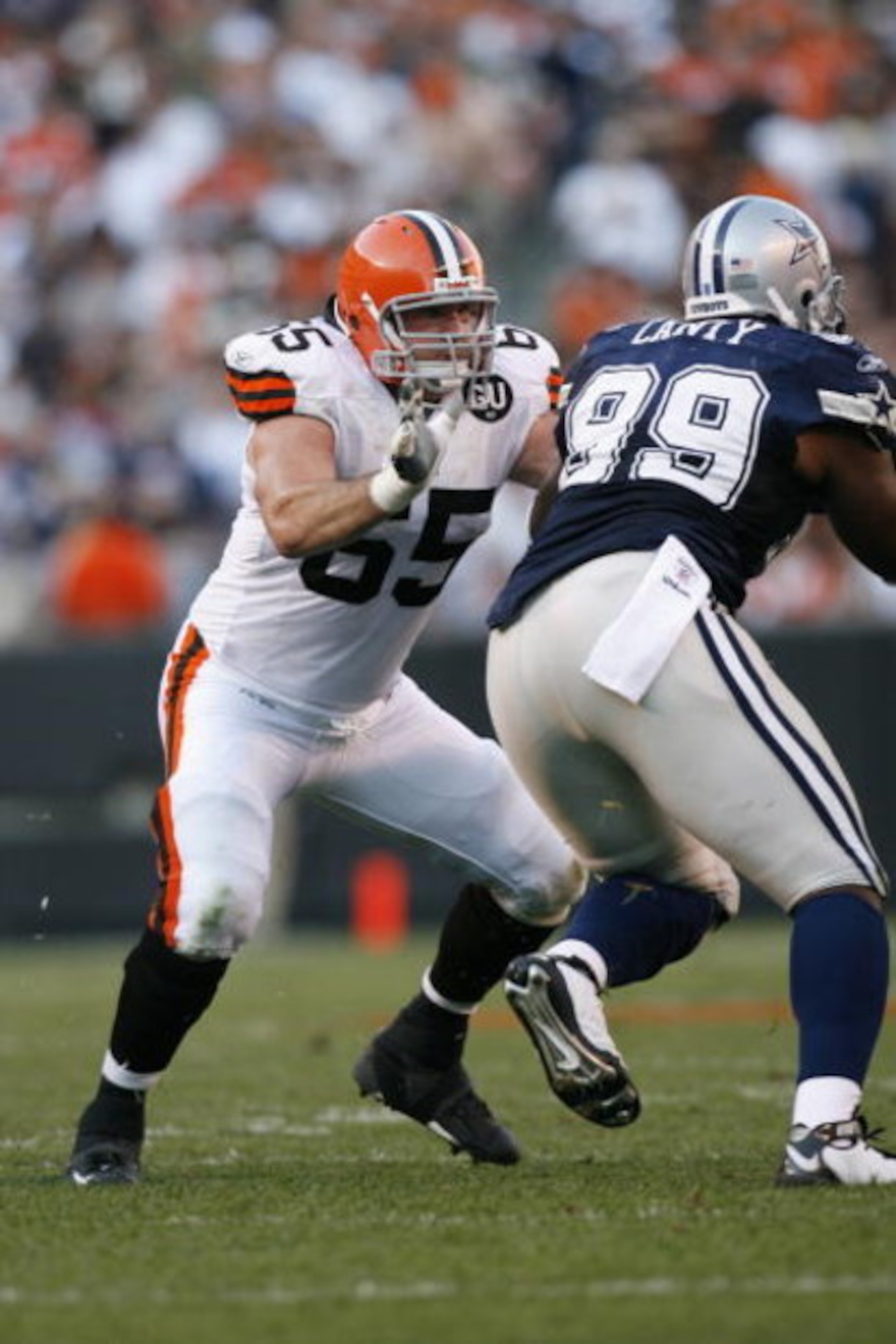CLEVELAND - SEPTEMBER 7:  Eric Steinbach #65 of the Cleveland Browns blocks Chris Canty #99 of the Dallas Cowboys during the game at Cleveland Browns Stadium on September 7, 2008 in Cleveland, Ohio.  (Photo by Kevin C. Cox/Getty Images)