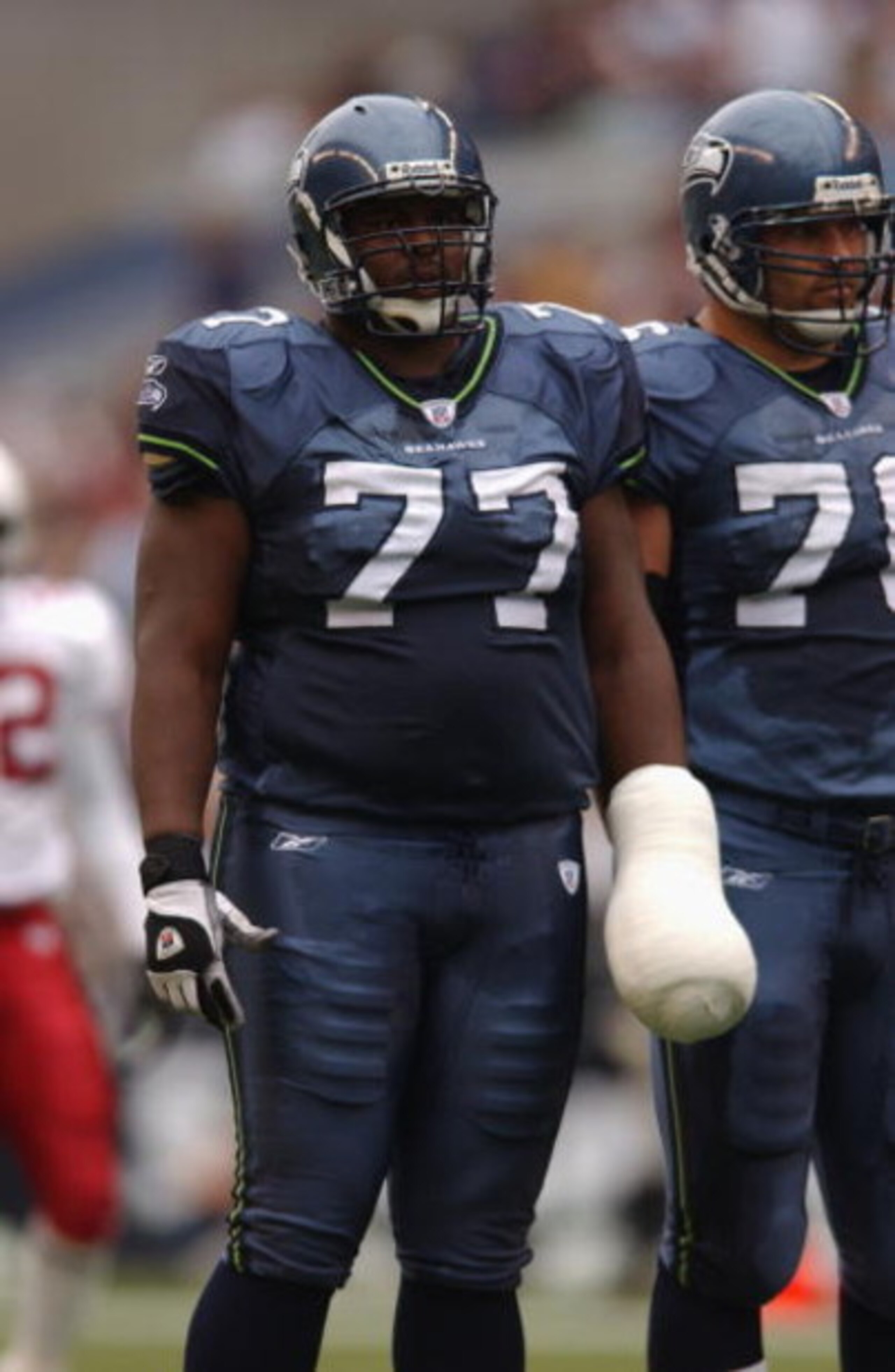SEATTLE - SEPTEMBER 15:  Tackle Floyd Womack #77 of the Seattle Seahawks looks on during the game against the Arizona Cardinals during the game on September15, 2002 at Seahawks Stadium in Seattle, Washington.  The Cardinals defeated the Seahawks 24-13.  (
