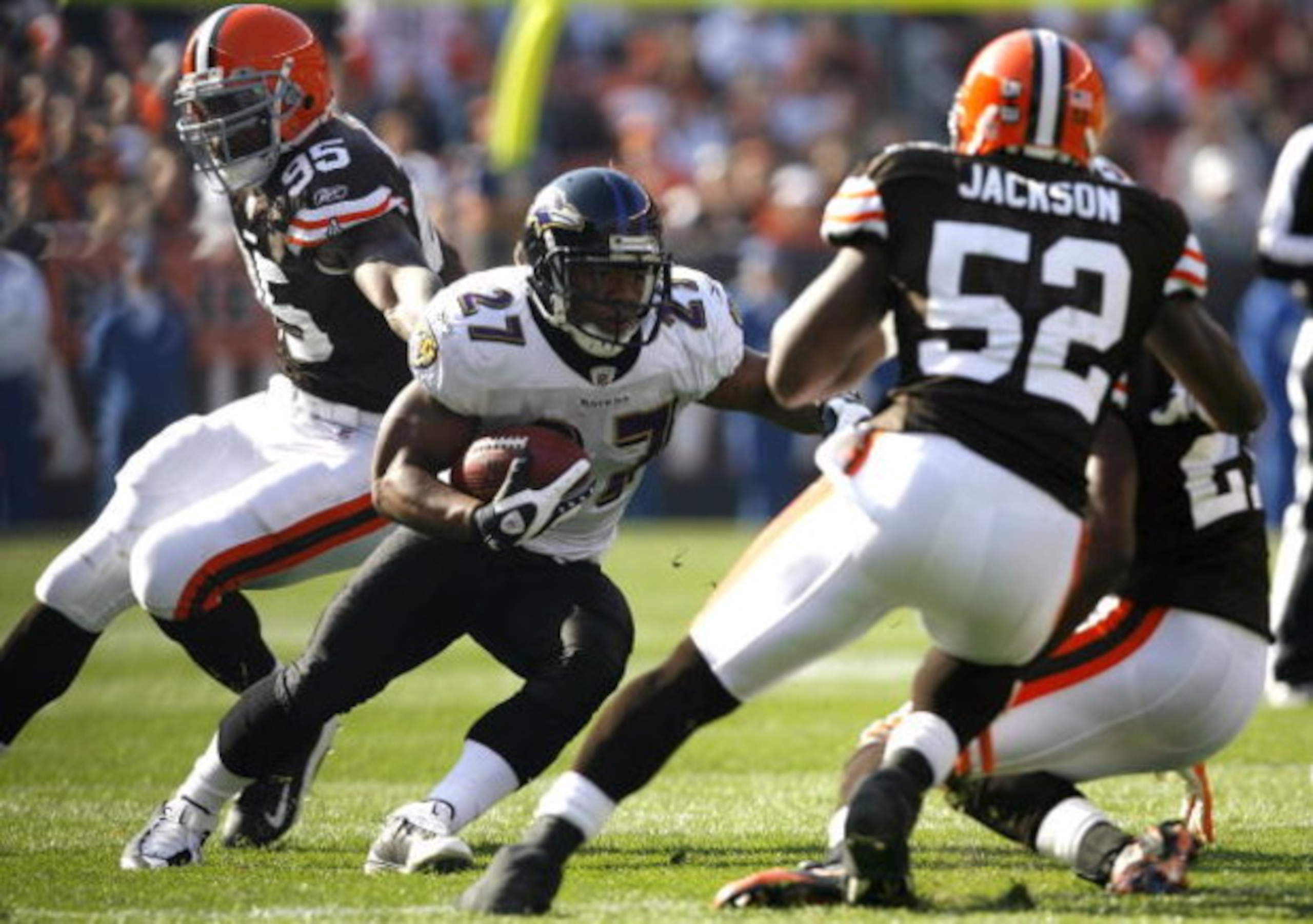 CLEVELAND - NOVEMBER 2:  Ray Rice #27 of the Baltimore Ravens runs the ball by Kamerion Wimbley #95 and D'Qwell Jackson #52 of the Cleveland Browns during the third quarter of their NFL game at Cleveland Browns Stadium November 2, 2008 in Cleveland, Ohio.