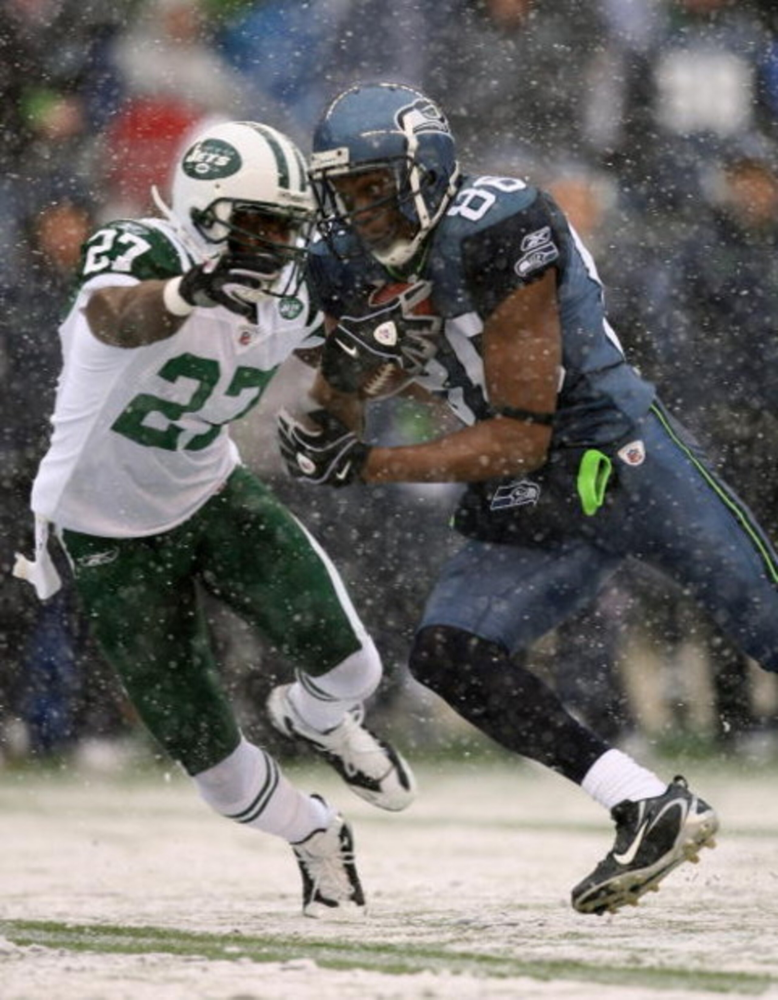 SEATTLE - DECEMBER 21:  Wide receiver Courtney Taylor #86 of the Seattle Seahawks rushes against Abram Elam #27 of the New York Jets on December 21, 2008 at Qwest Field in Seattle, Washington. (Photo by Otto Greule Jr/Getty Images)