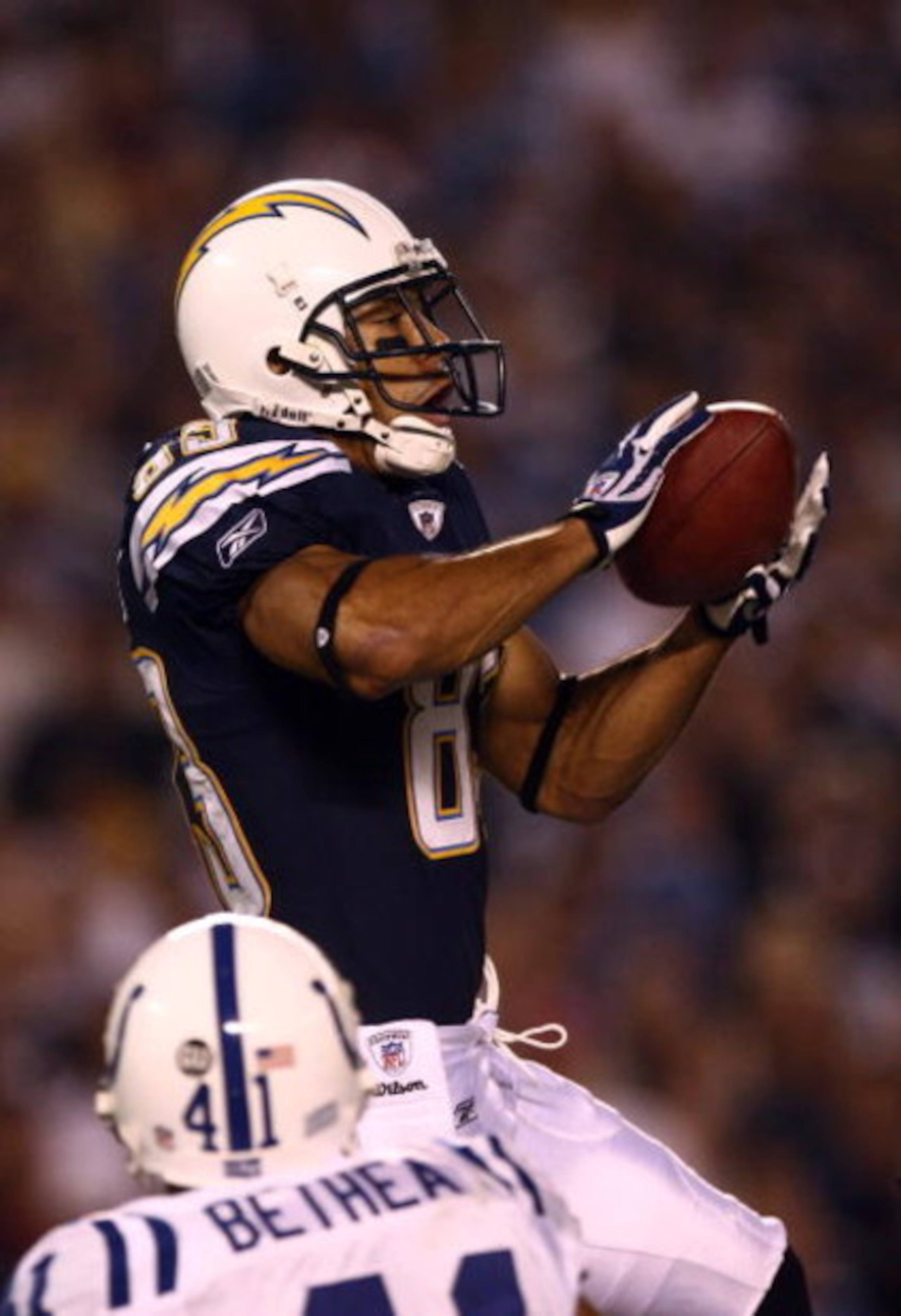 SAN DIEGO, CA - NOVEMBER 23:   Wide Receiver Vincent Jackson #83 of the San Diego Chargers goes up to catch a touchdown catch against the Indianapolis Colts during their NFL Game at Qualcomm Stadium on November 23, 2008 in San Diego, California. (Photo by