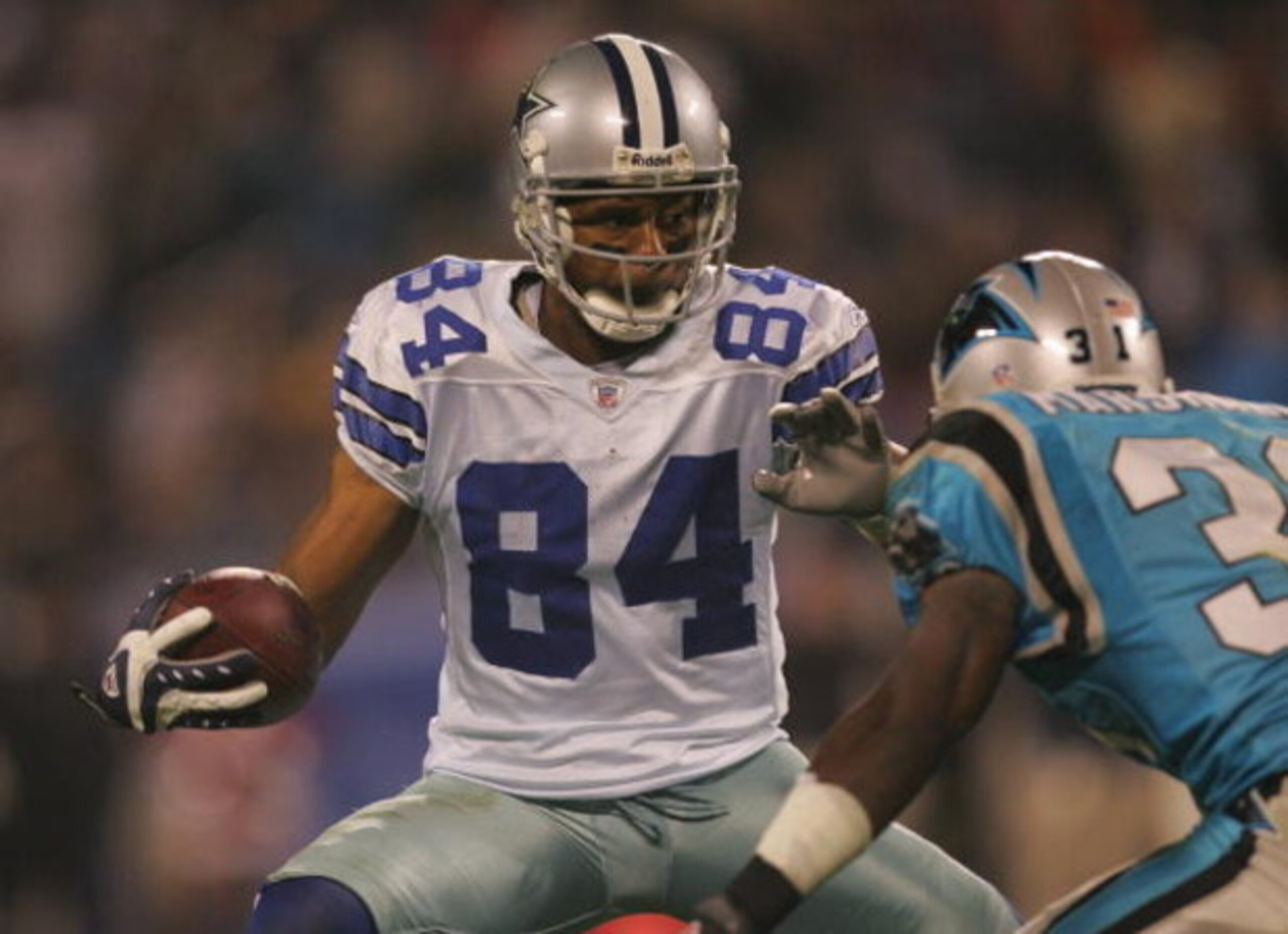 CHARLOTTE, NC - DECEMBER 22:  Patrick Crayton #84 of the Dallas Cowboys makes a move on the defender during the game against the Carolina Panthers at Bank of America Stadium on December 22, 2007 in Charlotte, North Carolina. (Photo by Streeter Lecka/Getty