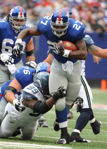 EAST RUTHERFORD, NJ - OCTOBER 05:  Brandon Jacobs #27 of the New York Giants runs against the Seattle Seahawks during their game on October 5, 2008 at Giants Stadium in East Rutherford, New Jersey.  (Photo by Al Bello/Getty Images)
