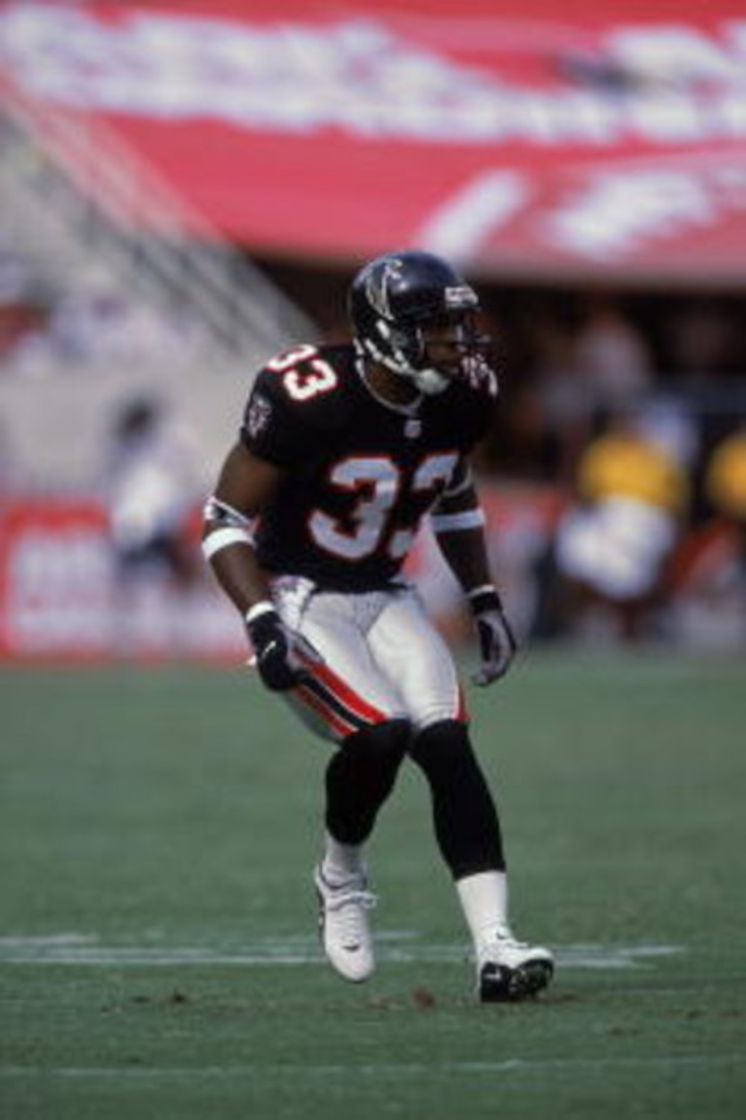 30 Sep 2001:  Ashley Ambrose #33 of the Atlanta Falcons in action during the game against the Arizona Cardinals at the Sun Devil Stadium in Tempe, Arizona.  The Falcons defeated the Cardinals 34-14.Mandatory Credit: Donald Miralle  /Allsport