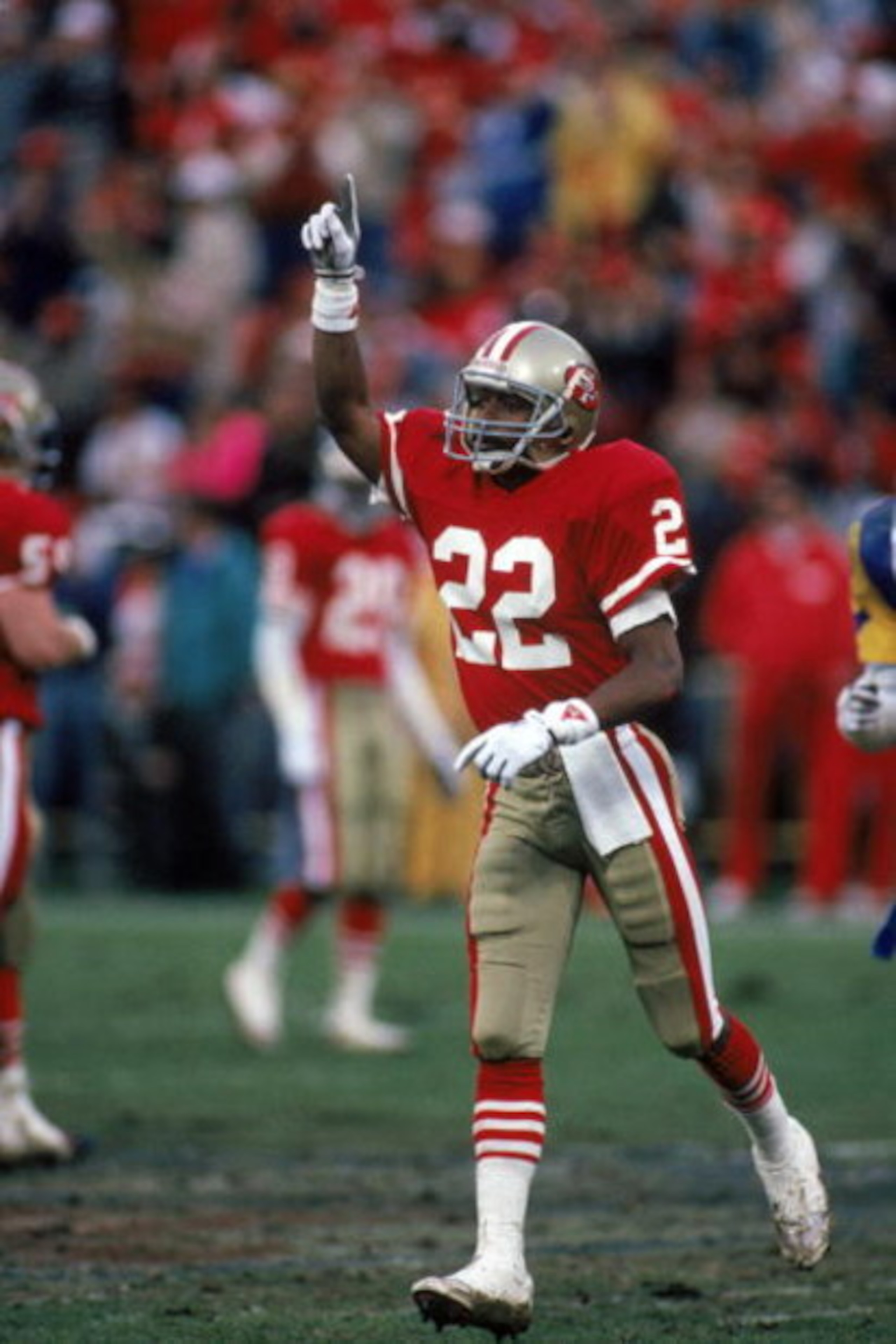 SAN FRANCISCO - JANUARY 14:  Cornerback Tim McKyer #22 of the San Francisco 49ers celebrates after a play during the NFC Championship game against the Los Angeles Rams at Candlestick Park on January 14, 1990 in San Francisco, California.  (Photo by George