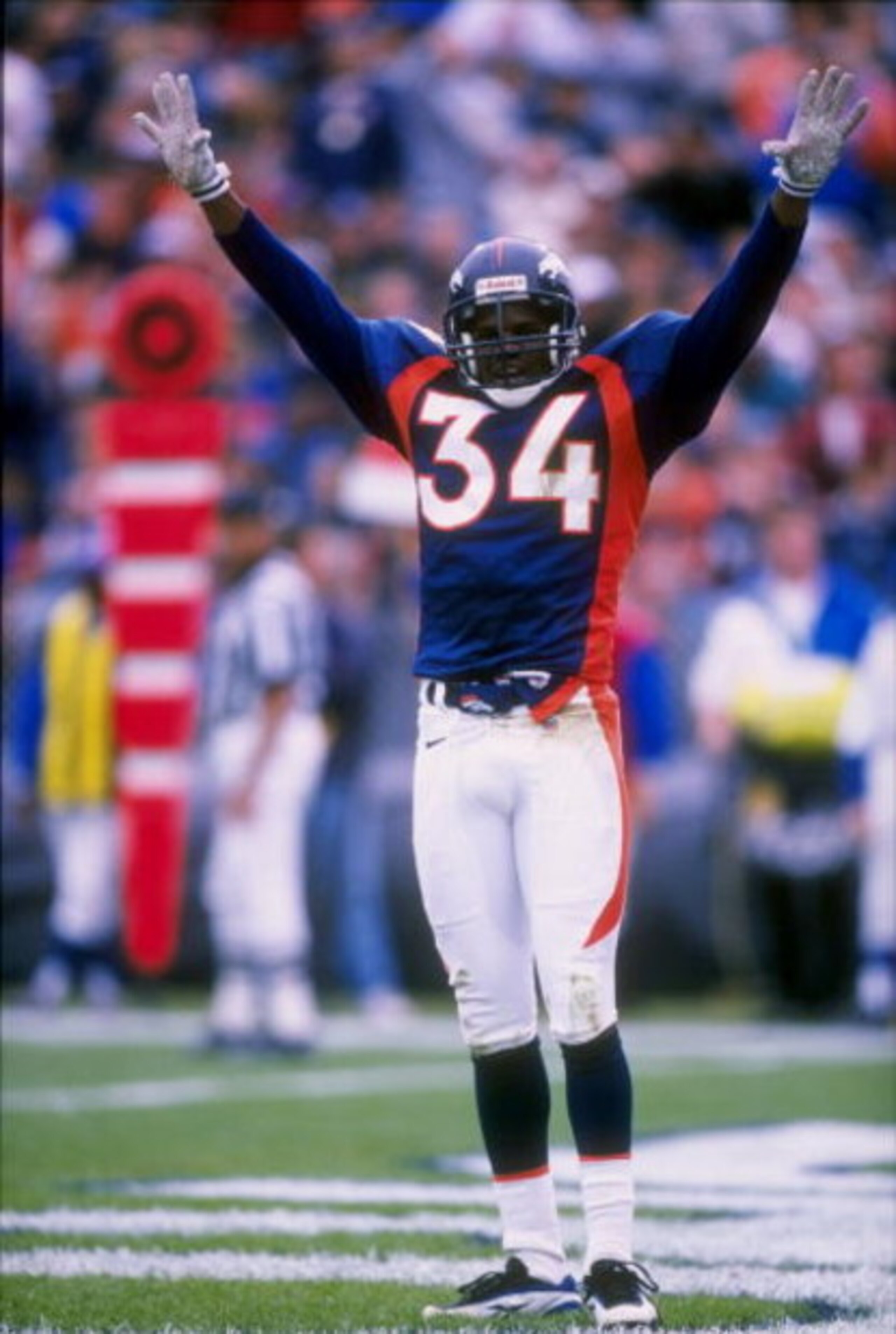 21 Sep 1997:  Defensive back Tyrone Braxton #34 of the Denver Broncos celebrates during the Broncos 38-20 win over the Cincinnati Bengals at Mile High Stadium in Denver, Colorado. Mandatory Credit: Stephen Dunn  /Allsport