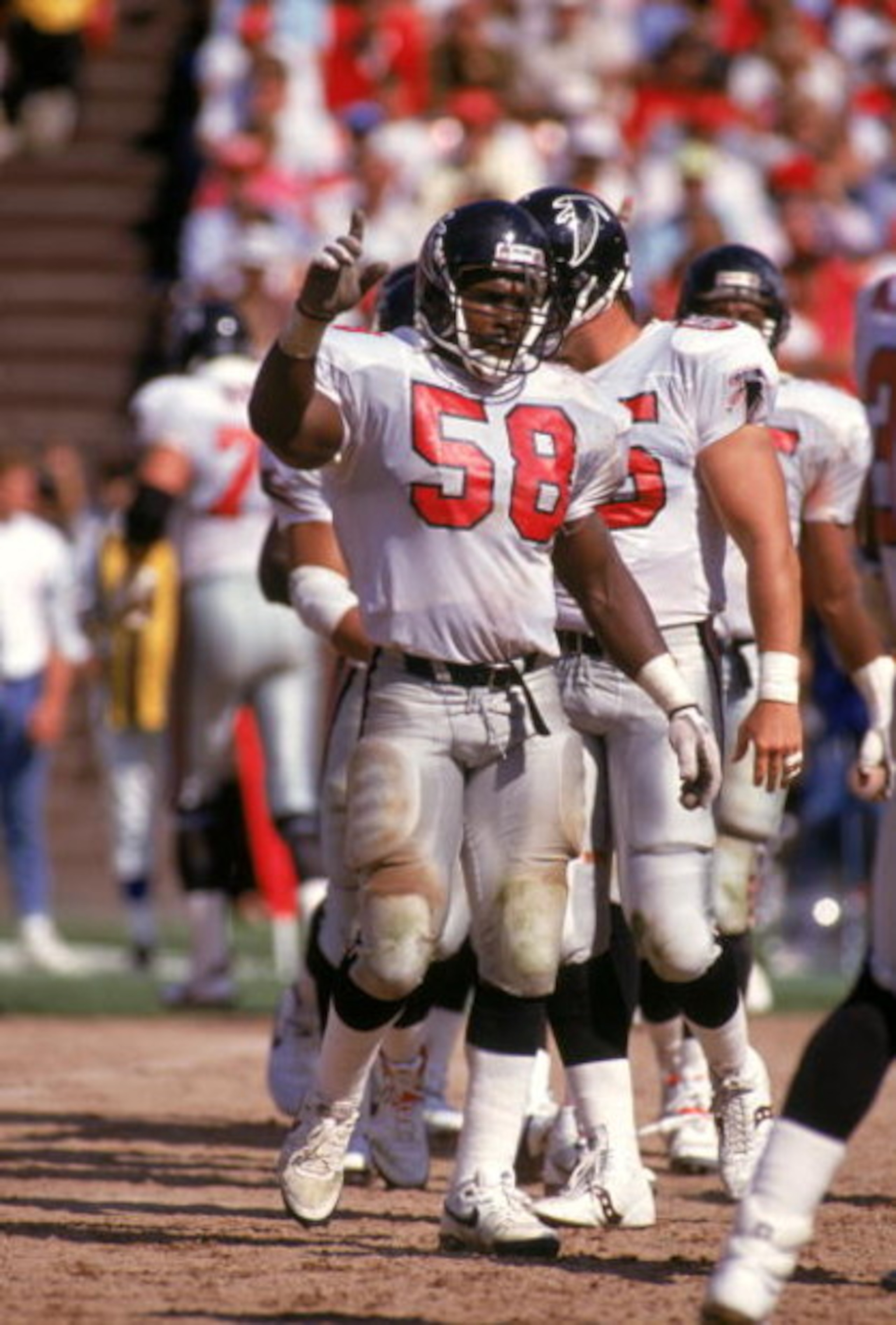 SAN FRANCISCO - SEPTEMBER 23:  Linebacker Jessie Tuggle #58 of the Atlanta Falcons on the field before a play during a game against the San Francisco 49ers at Candlestick Park on September 23, 1990 in San Francisco, California.  (Photo by George Rose/Gett