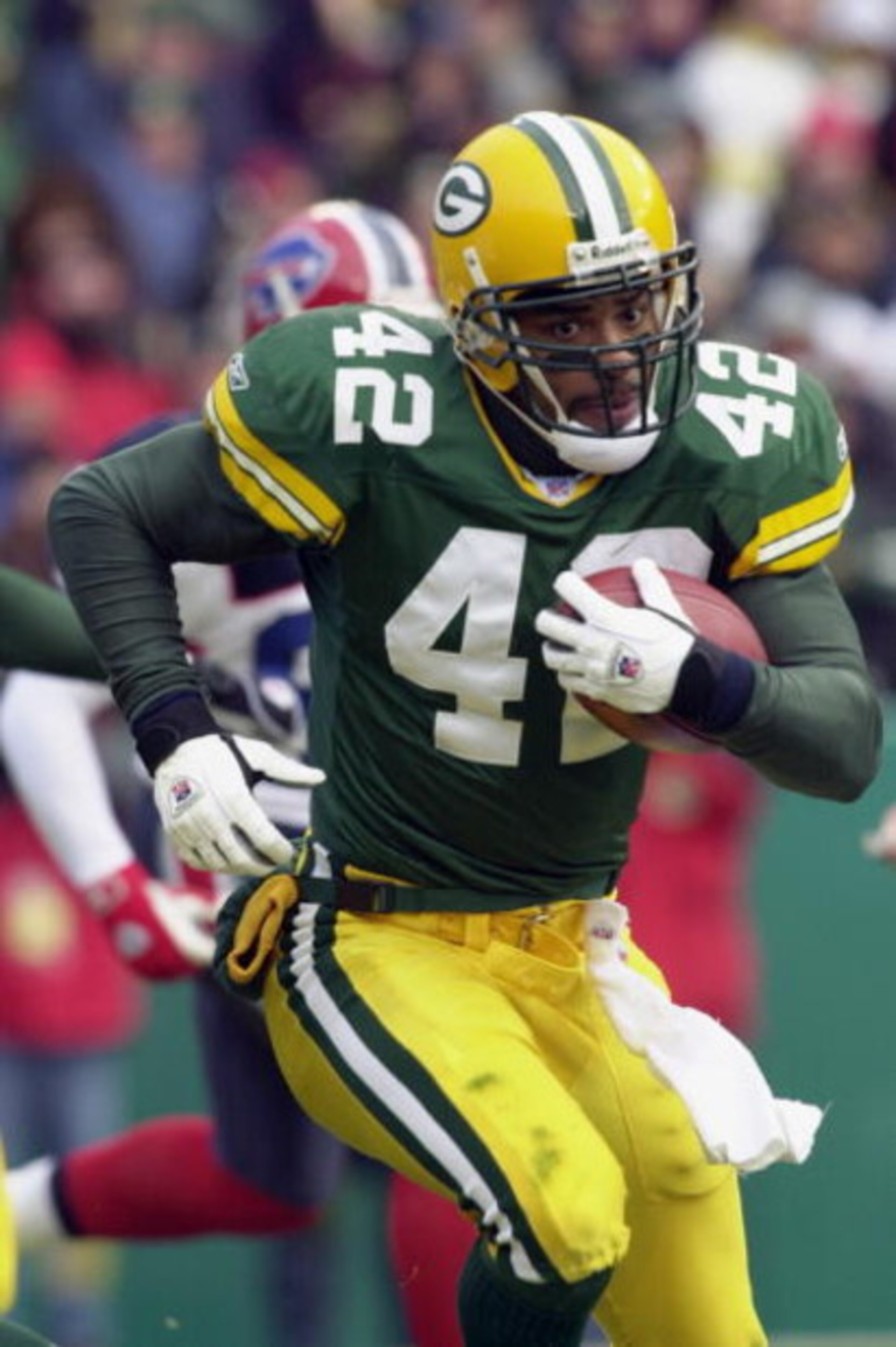 GREEN BAY, WI - DECEMBER 22:  Safety Darren Sharper #42 of the Green Bay Packers returns an interception against the Buffalo Bills before being injured on the play early during their game on December 22, 2002 at Lambeau Field in Green Bay, Wisconsin.  The