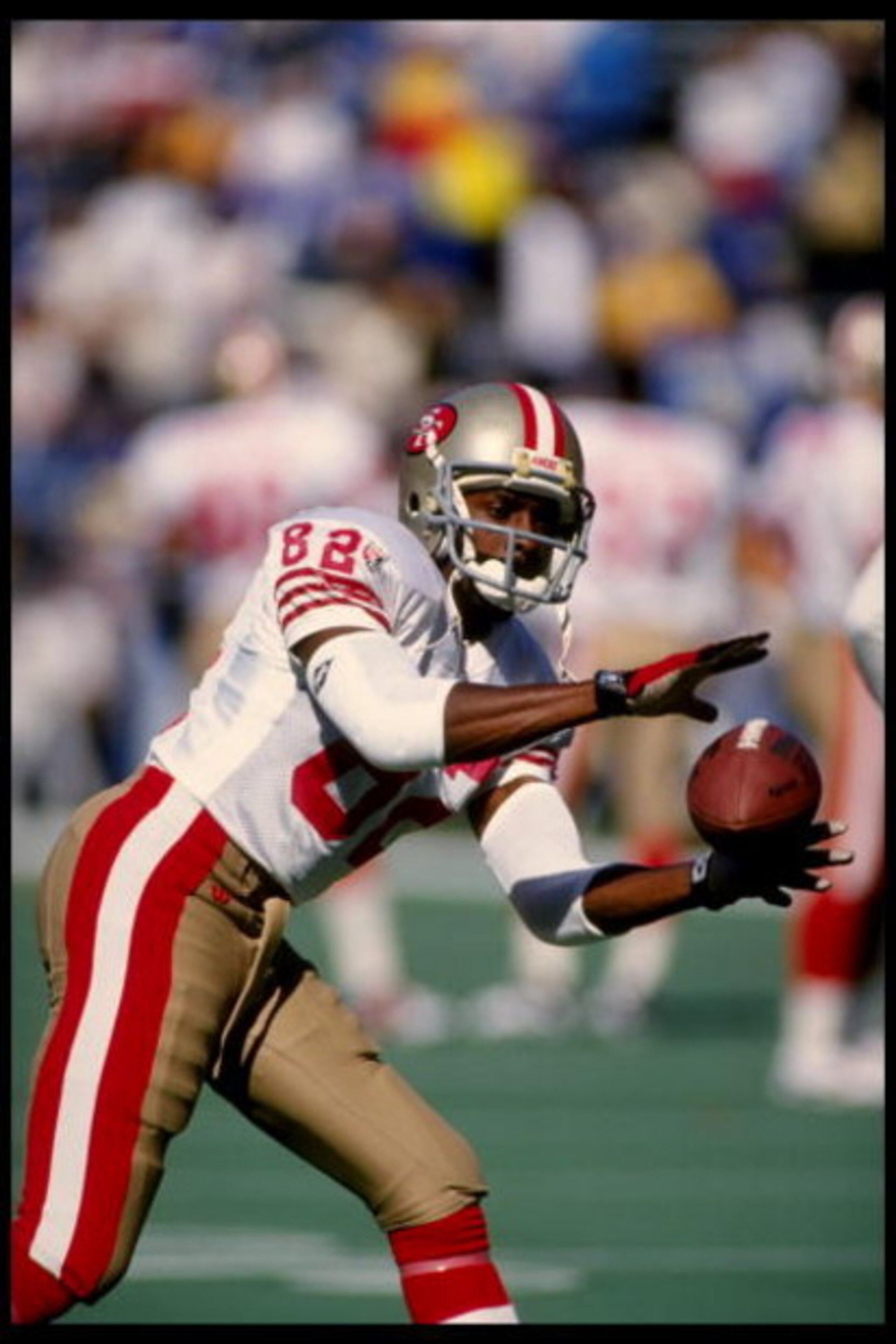 22 Oct 1995:  Wide receiver John Taylor of the San Francisco 49ers catches a pass during warm-ups prior to a 44-10 win over the St. Louis Rams at Busch Stadium in St. Louis, Missouri.  Mandatory Credit:  Brian Bahr/Allsport