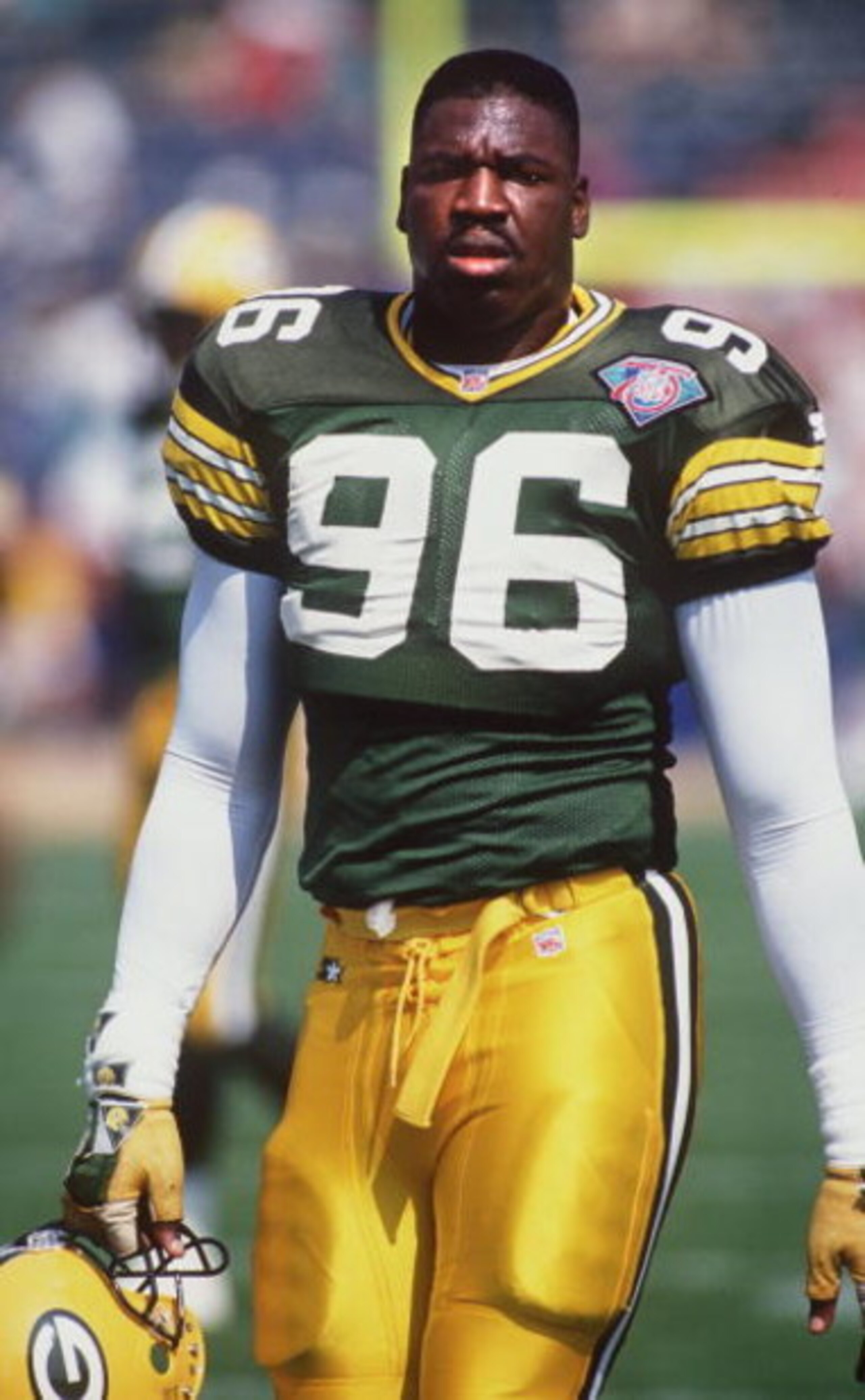 11 SEP 1994:  SEAN JONES OF THE GREEN BAY PACKERS WALKS OFF THE FIELD DURING A 24-14 LOSS TO THE MIAMI DOLPHINS. Mandatory Credit: Jonathan Daniel/ALLSPORT