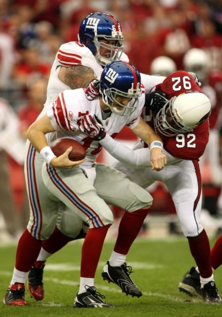 GLENDALE, AZ - NOVEMBER 23: Bertrand Berry #92 of the Arizona Cardinals sacks quarterback Eli Manning #10 of the New York Giants in front of Giants tackle David Diehl #66 on November 23, 2008 at University of Phoenix Stadium in Glendale, Arizona.  (Photo 