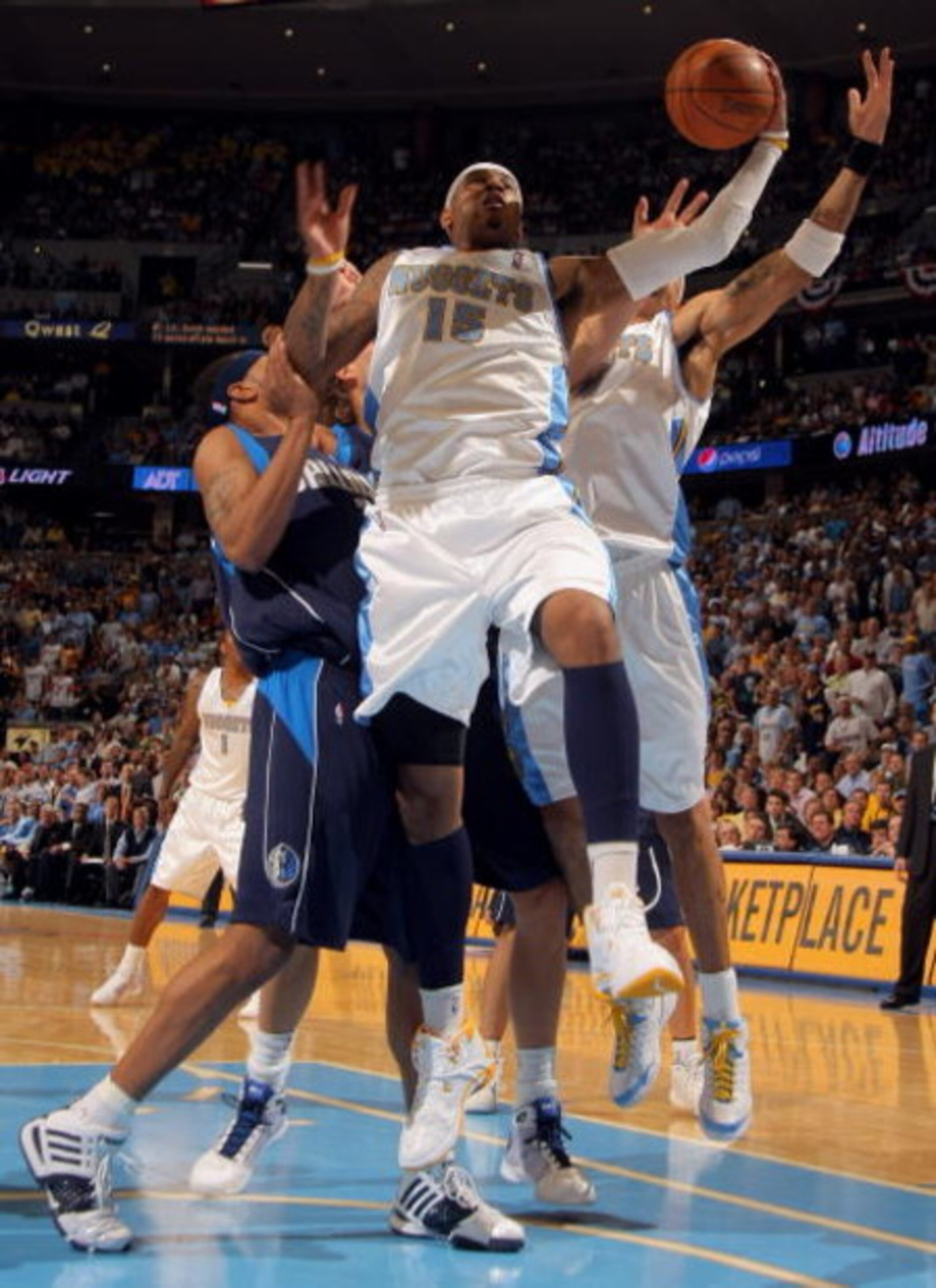 DENVER - MAY 13:  Carmelo Anthony #15 of the Denver Nuggets grabs a rebound against the Dallas Mavericks in Game Five of the Western Conference Semifinals during the 2009 NBA Playoffs at Pepsi Center on May 13, 2009 in Denver, Colorado. NOTE TO USER: User