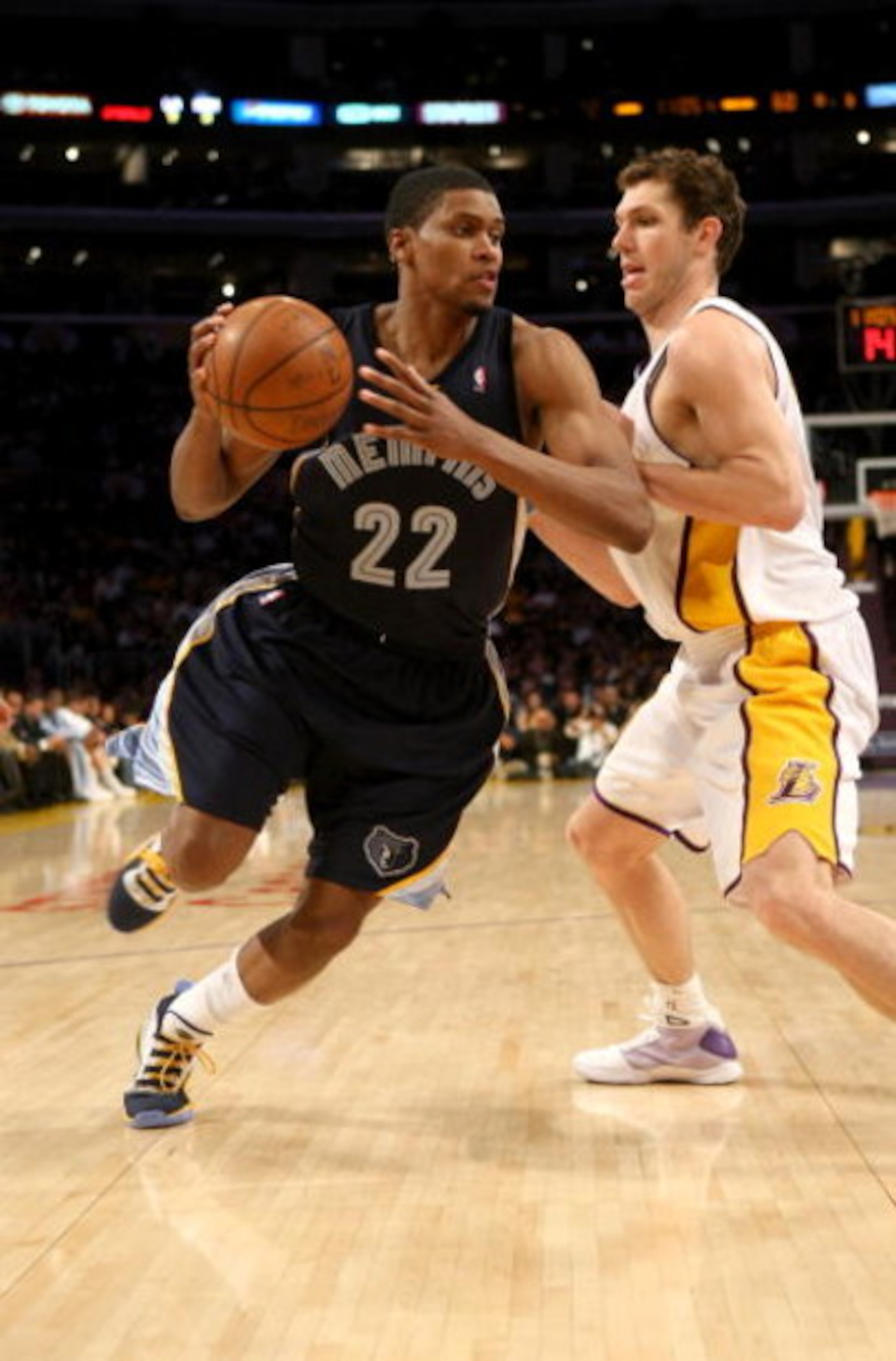 LOS ANGELES - APRIL 12: Rudy Gay #22 of the Memphis Grizzlies drives around Luke Walton #4 of the Los Angeles Lakers on April 12, 2009 at Staples Center in Los Angeles, California. The Lakers won 92-75. NOTE TO USER: User expressly acknowledges and agrees