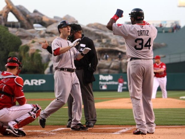 ANAHEIM, CA - MAY 13: Jason Bay #44 of the Boston Red Sox is greeted at home by David Ortiz #34 after Bay's two run home run in the first inning against the Los Angeles Angels of Anaheim on May 13, 2009 at Angel Stadium in Anaheim, California.   (Photo by